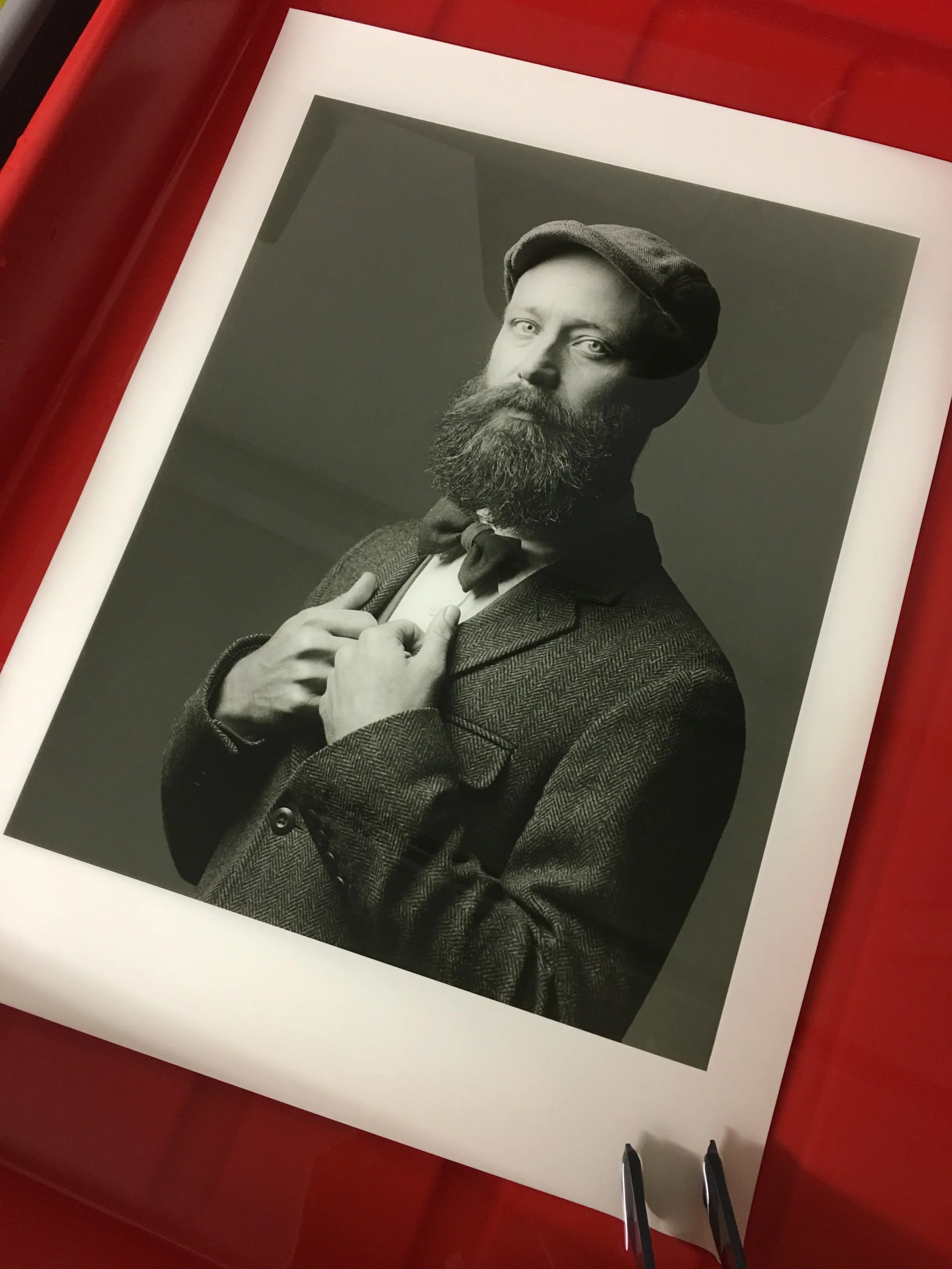 A print being made in the darkroom.