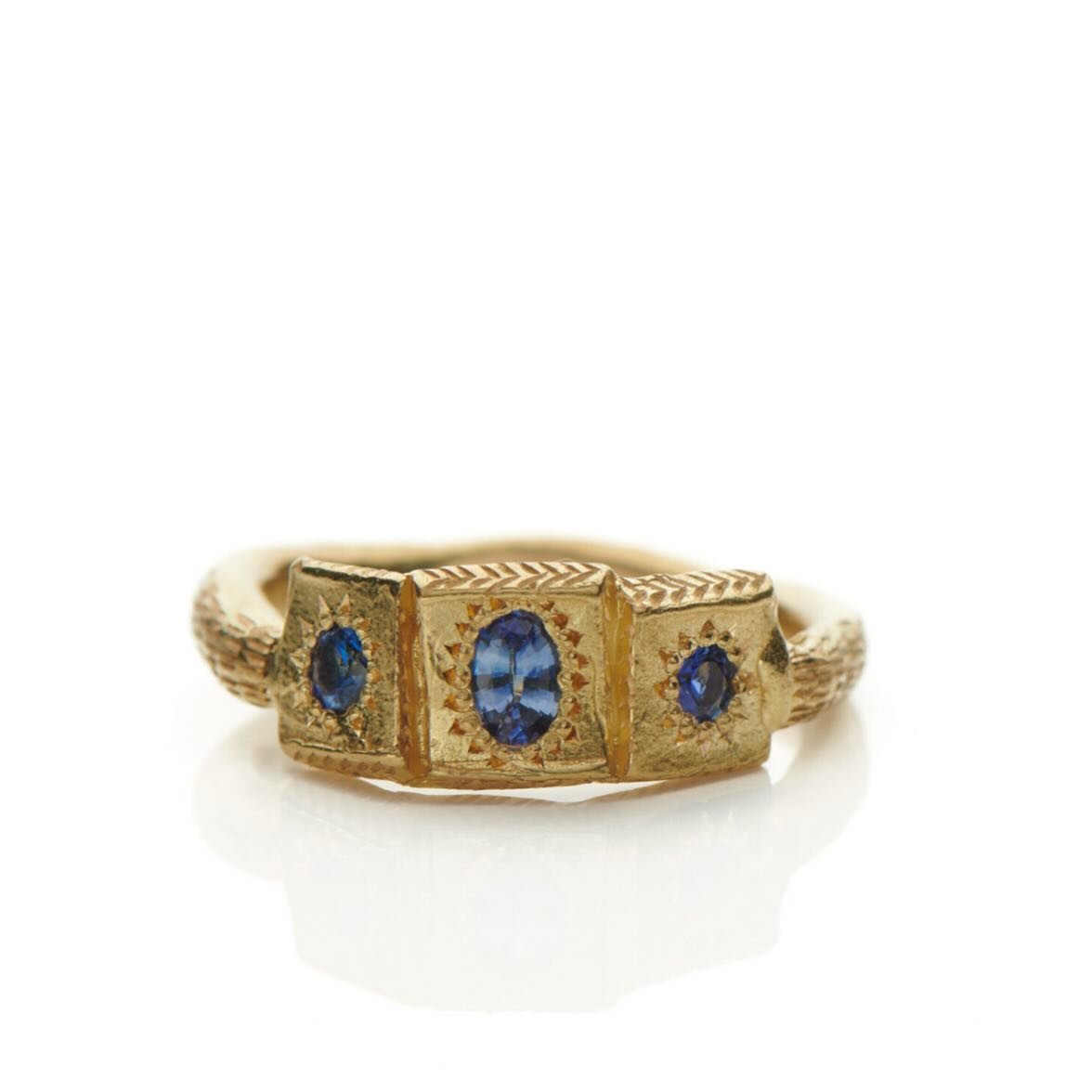 18ct Caravel ring set with Ceylon sapphires.

This ring was made initially for my Mum. Three is an important number in my family, as I am one of three children. My Mum asked for a ring that had three gemstones in it to represent us. 
At the time I wa