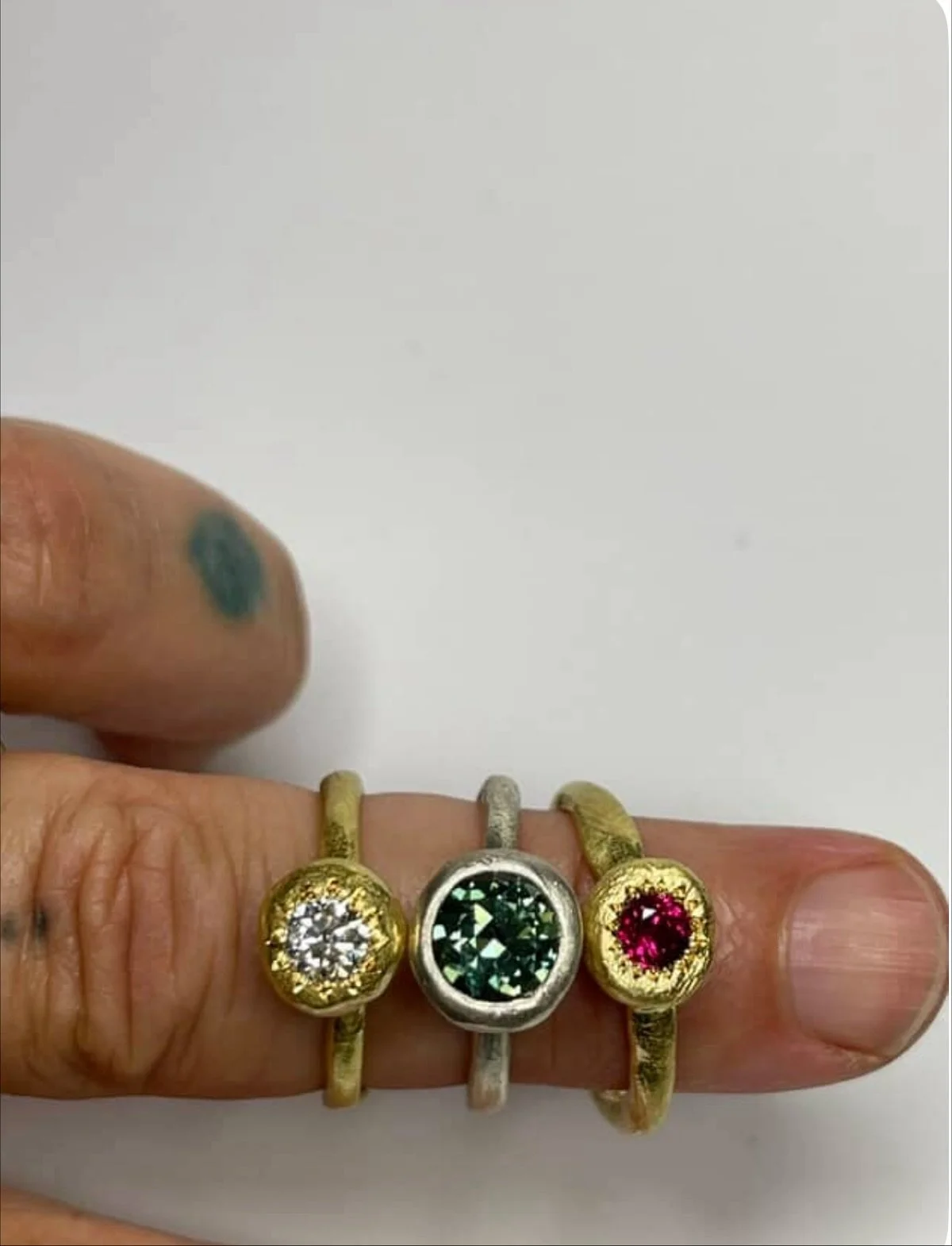 Three rings.

Each very simple, I wanted the materials to be the hero here. Precious metals holding precious gemstones.

18ct yellow gold My Beloved ring, set with a diamond.

9ct white gold Large Pledge ring set with an Australian parti sapphire.

1