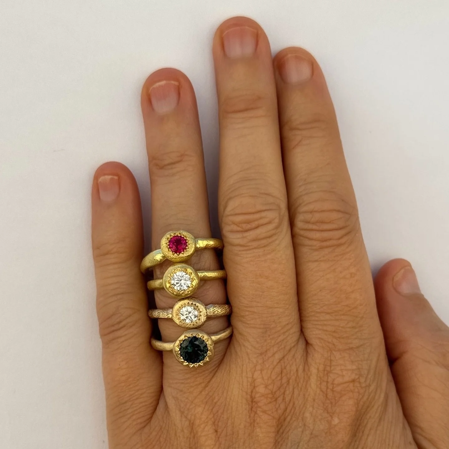 | have been making variations of these three rings for more than 20 years.

The Large Pledge ring can hold up to a 7mm round gemstone. As a pledge is a solemn promise or undertaking. This ring design sits higher, the shank is thinner to accentuate th