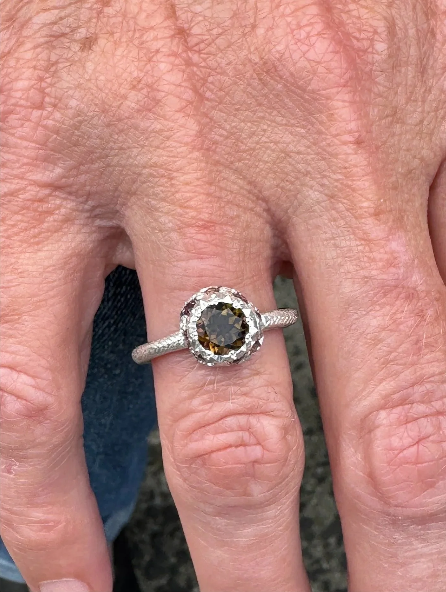A beautiful combination of natural gemstones.
#117.
Series of One.
Hand engraved sterling silver, set with a central brown tourmaline and surrounded by natural coloured sapphires.

Available at the studio (open by appointment) and on the online store