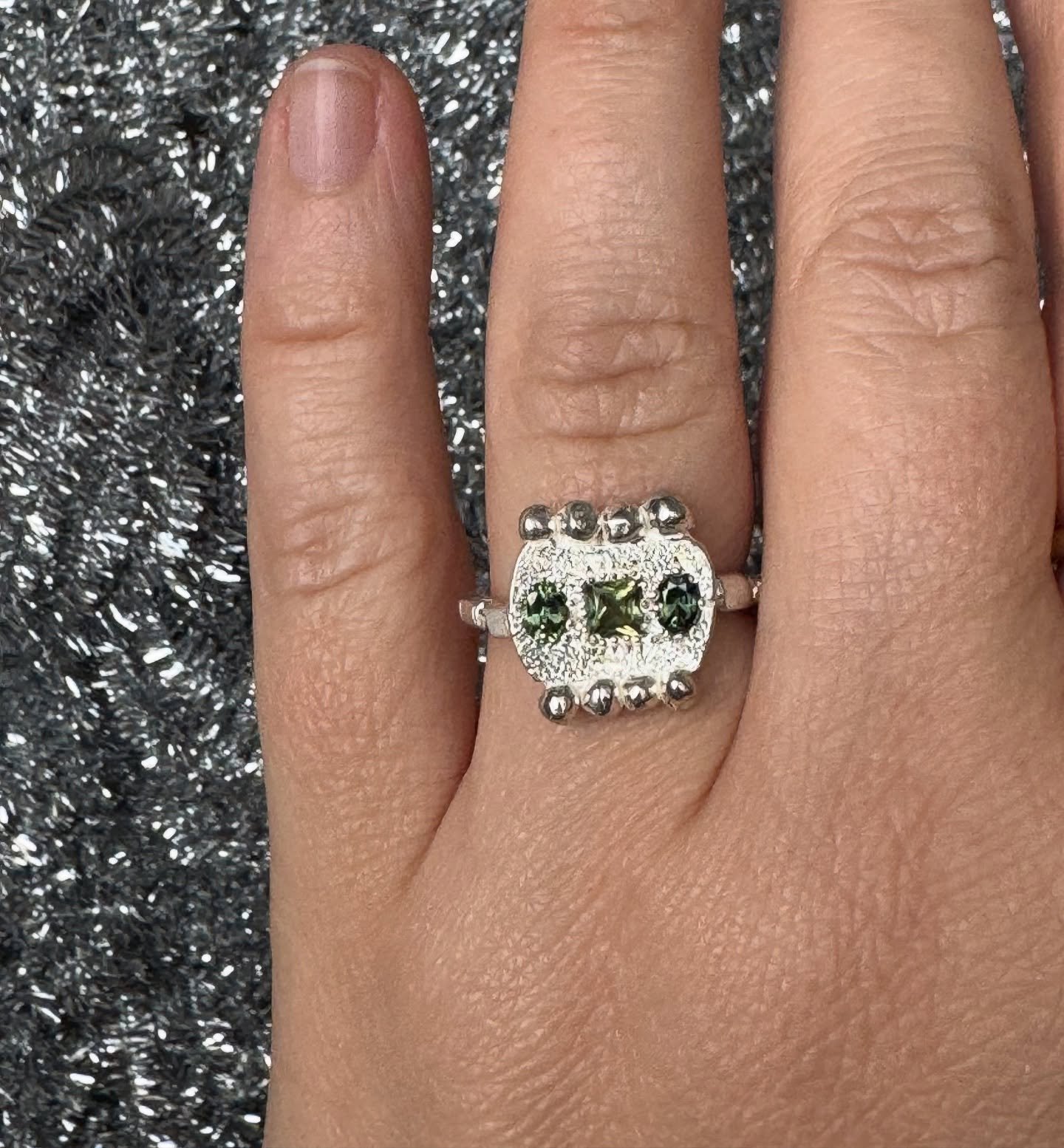 Handmade sterling silver ring set with natural Australian sapphires and hand-engraving.

#139. Series of One

3.5mm square and 2 &times; 4&times;3mm oval natural Australian sapphires.

Standard size: c. Q
*This ring can be resized. Please email for s