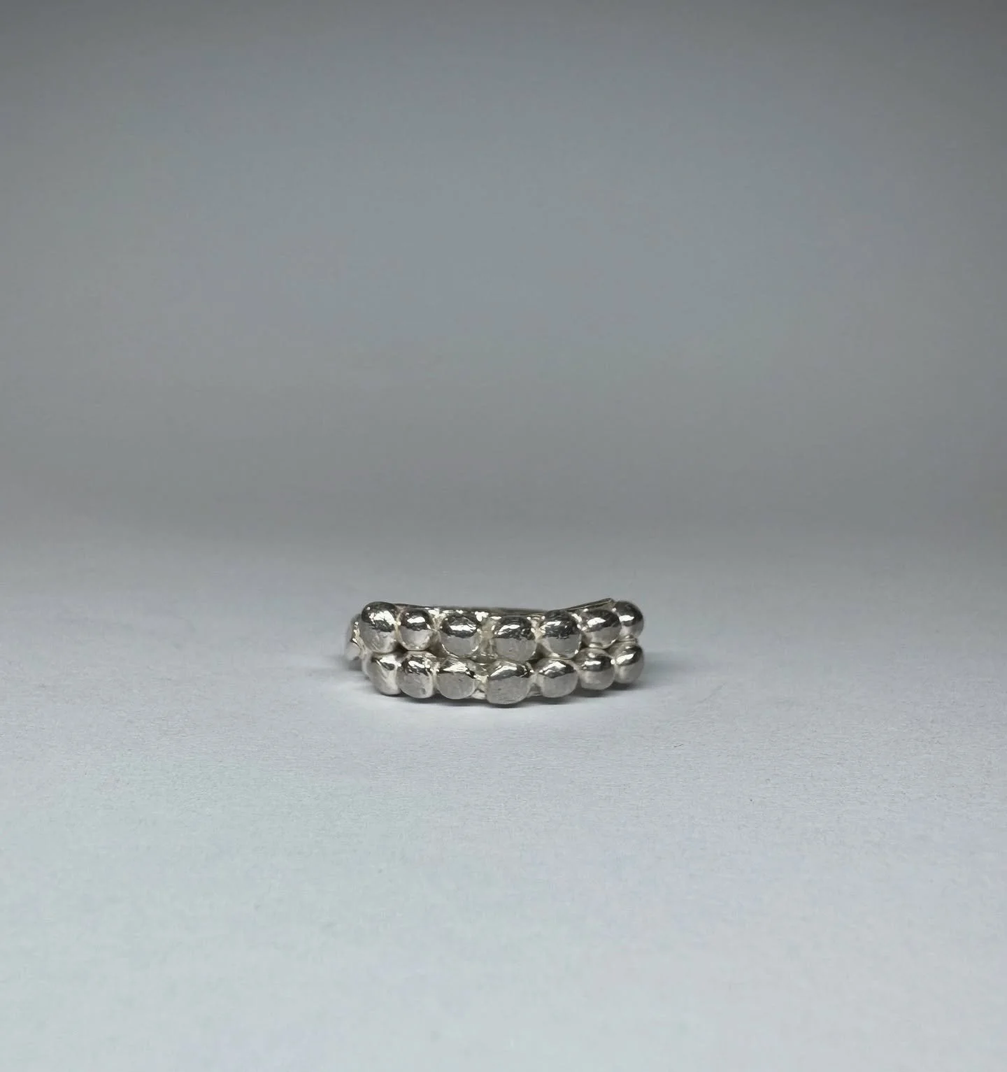 #136.
Handmade sterling silver ring with hand engraving.
Standard size: c. R
*This ring can be resized. Please email for sizing information.
Measurements: top of ring c. 24mm x 7.2mm; width of ring shank
c. 2.5mm
This ring is ready to be shipped now.