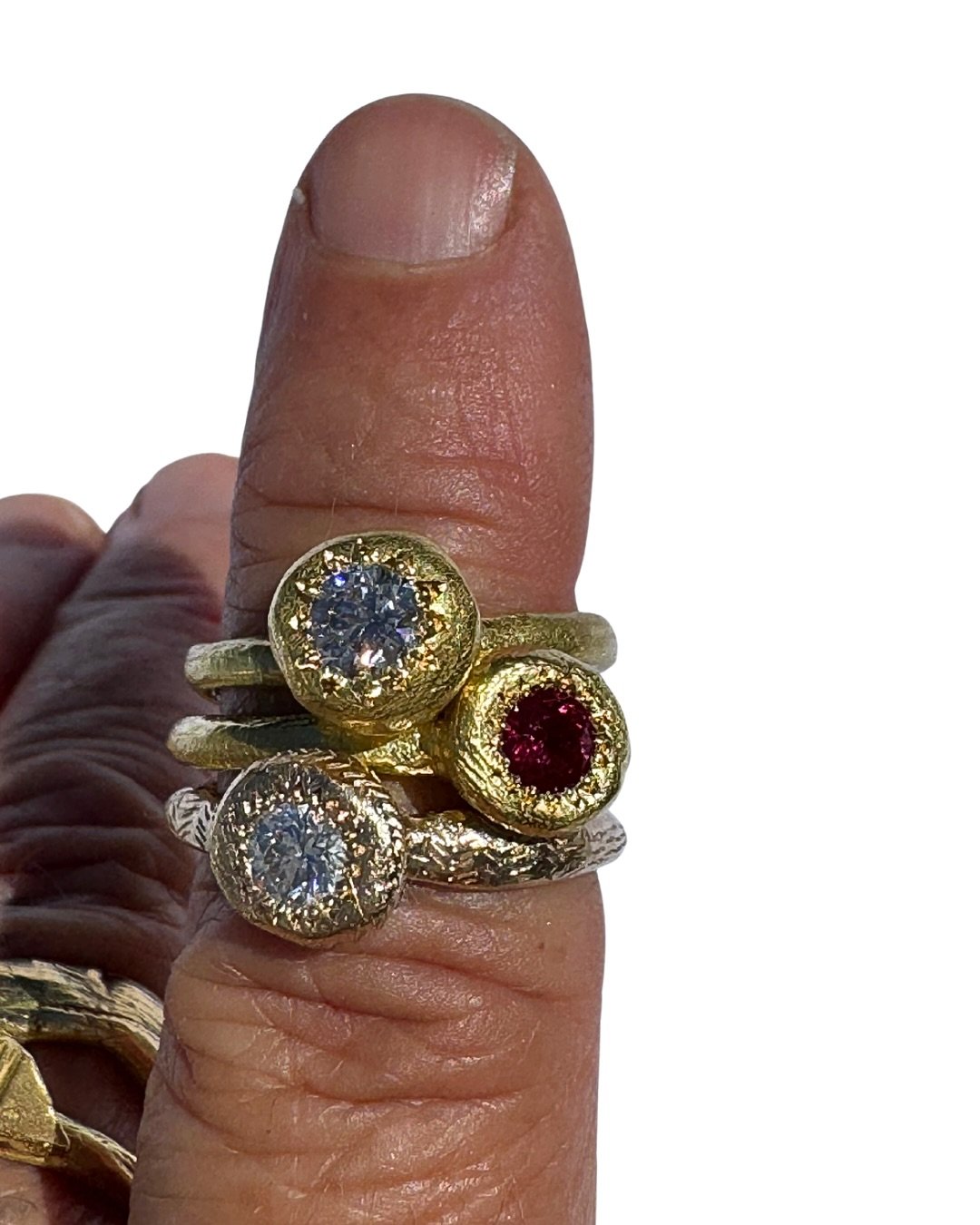 Three rings

My Beloved set with a diamond.
To Hold, one engraved with a diamond, the other with a natural ruby.

Simple designs handmade with beautiful materials. 
These three rings are available to purchase directly through my studio. 
Email info@k