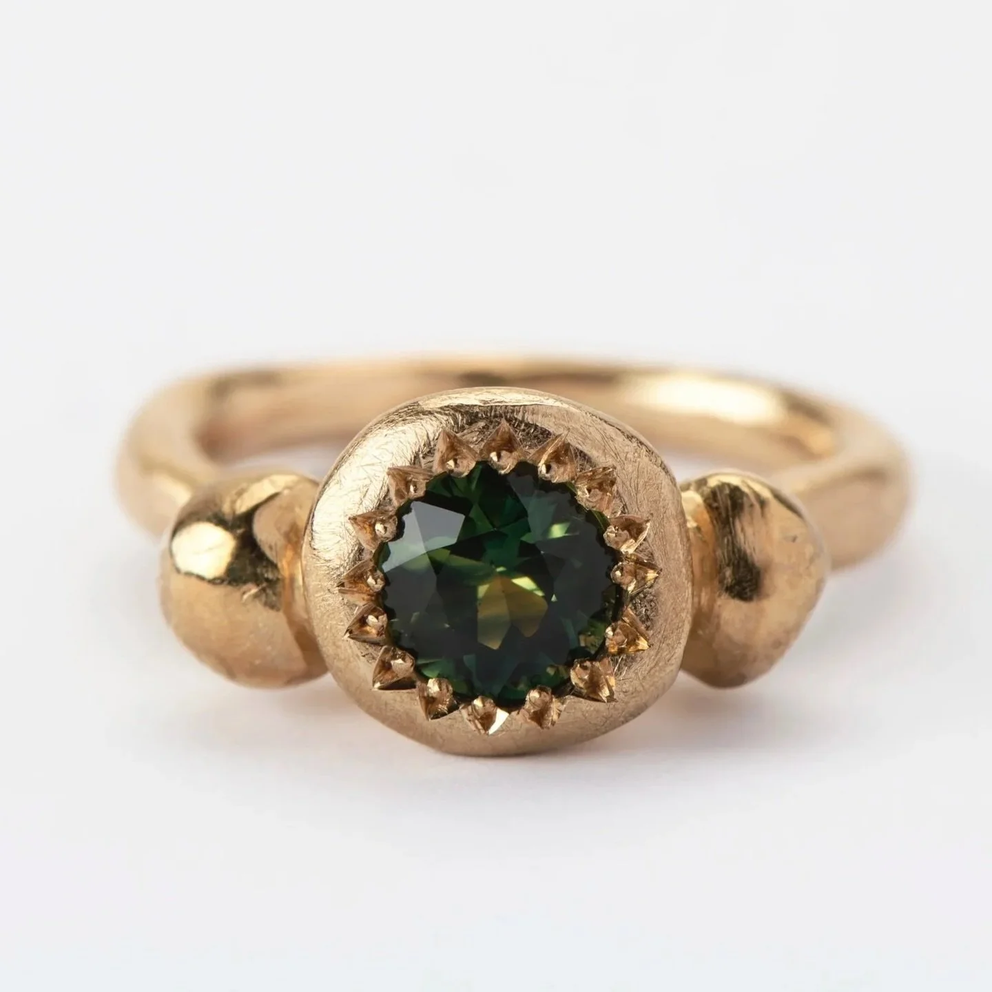 9ct yellow gold Metier ring set with the most beautiful natural Australian parti sapphire.

I named this ring Metier because the ring is strong and sure. Metier meaning an area of activity in which a person excels.

The setting here is heavy! The lar