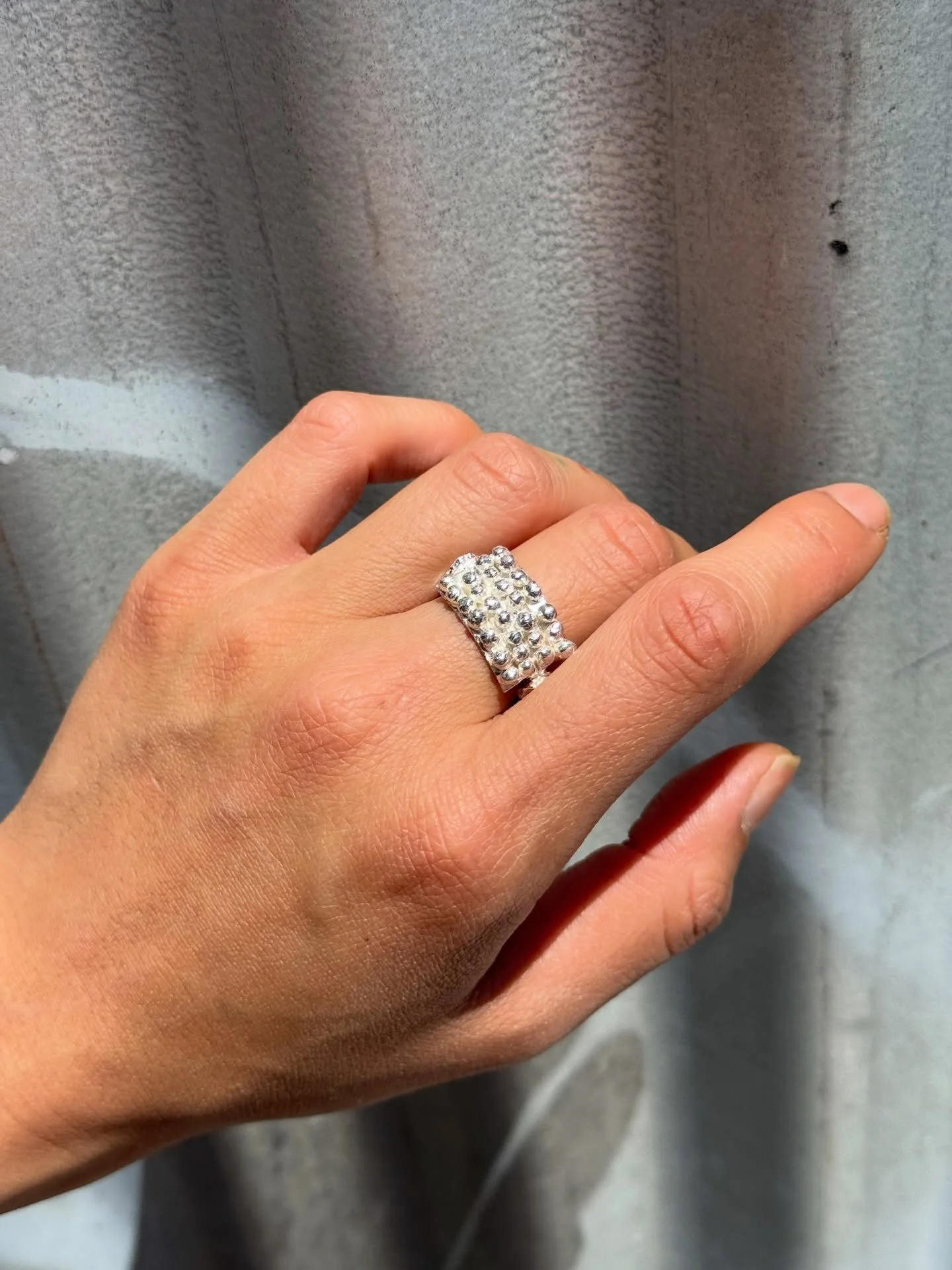 #131.
Handmade sterling silver ring with hand engraving.

Standard size: c. O 1/2
*This ring can be resized. Please email for sizing information.
Measurements: top of ring c. 19mm x 11.5mm x 3.8mm; width of ring shank c. 3 &times; 3mm

This piece is 