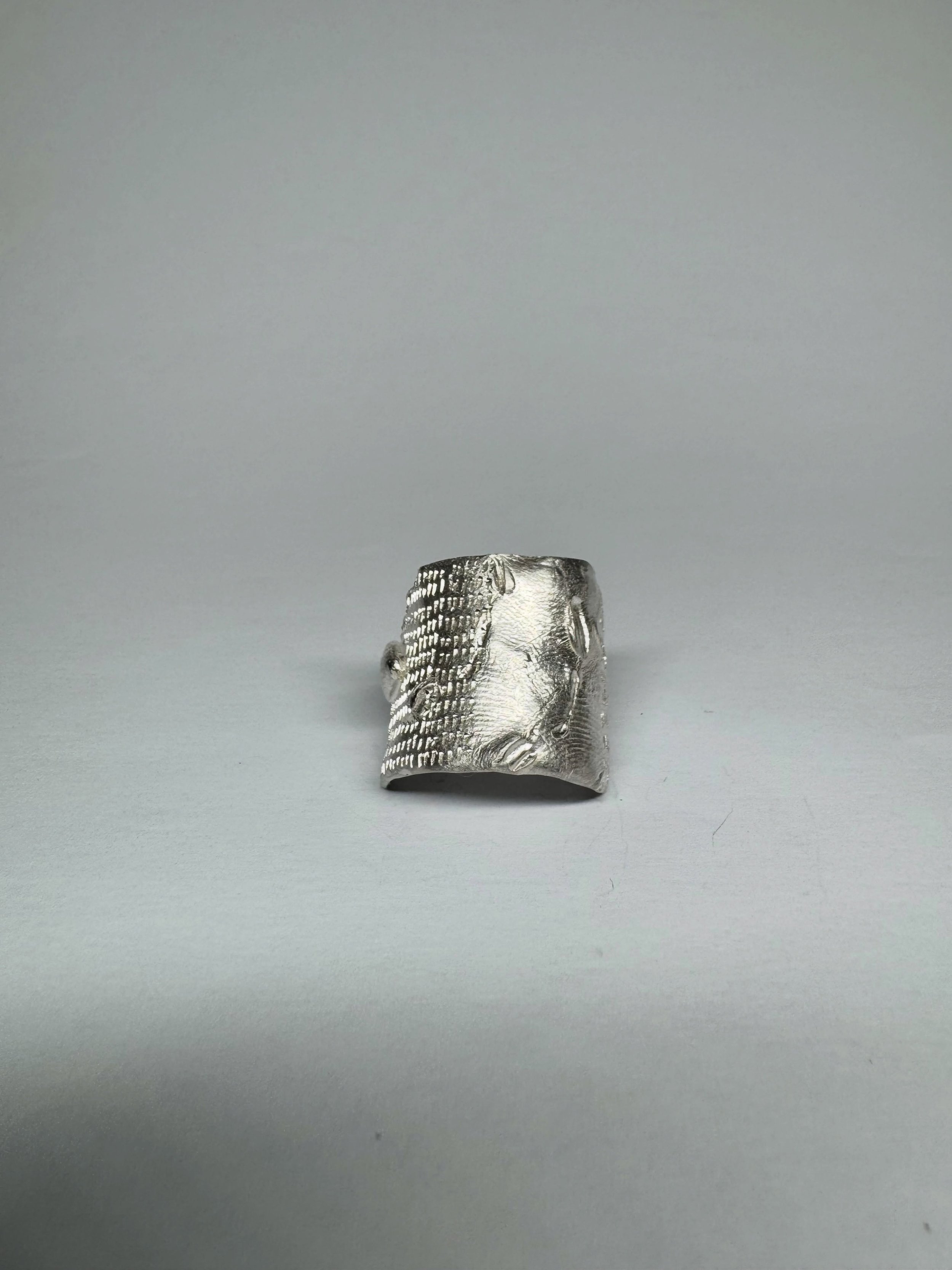 #154.
Handmade sterling silver ring with hand-engraving.

Standard size: c. R
*This ring can be resized. Please email for sizing information.
Measurements: width c. 22.7mm x 21mm x 1.5mm, ring shank 3.5mm

This piece is a one-off and not intended to 