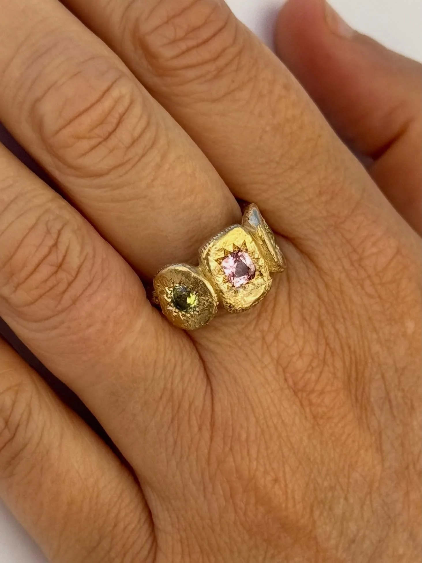My Constant Ring
9ct yellow gold set with 4.5mm square cushion cut pink sapphire 0.46ct, 2 x 4mm round natural Australian yellow/green parti sapphires.

There is only one of these rings - The My Constant Ring is available online now. Link in bio. Ple