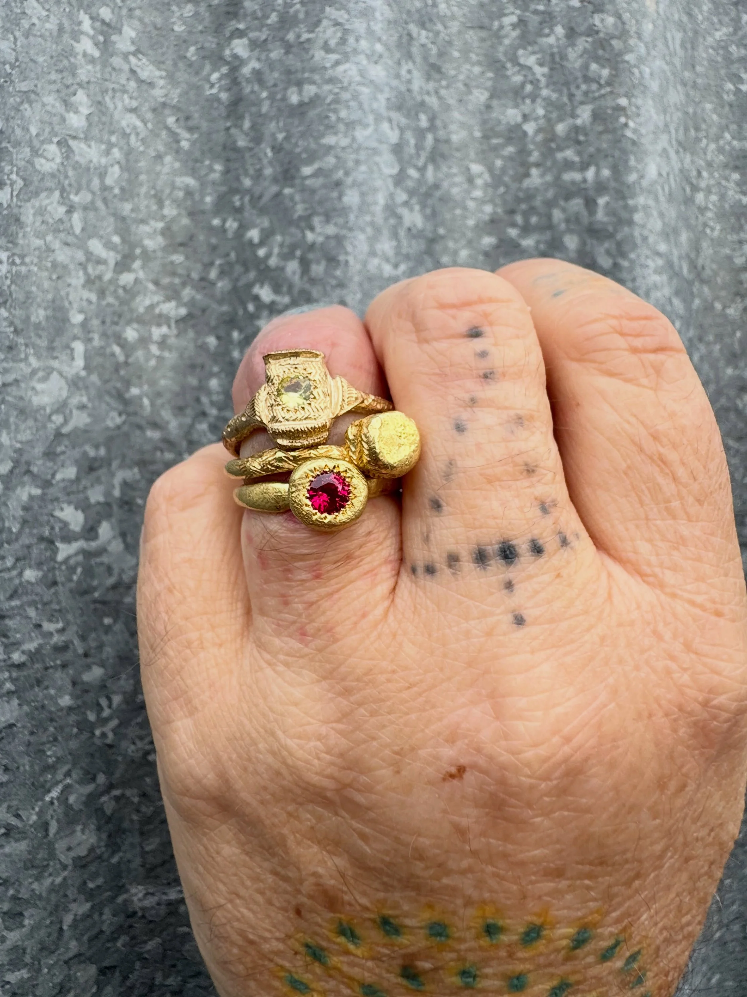 Today&rsquo;s Ring Stack.

From the top:

#48. Series of One.
9ct yellow gold with natural Australian sapphire and hand engraving.

Encens Ring
18ct yellow gold with hand engraving.

To Hold Ring
18ct yellow gold with Ruby.

All three of these rings 