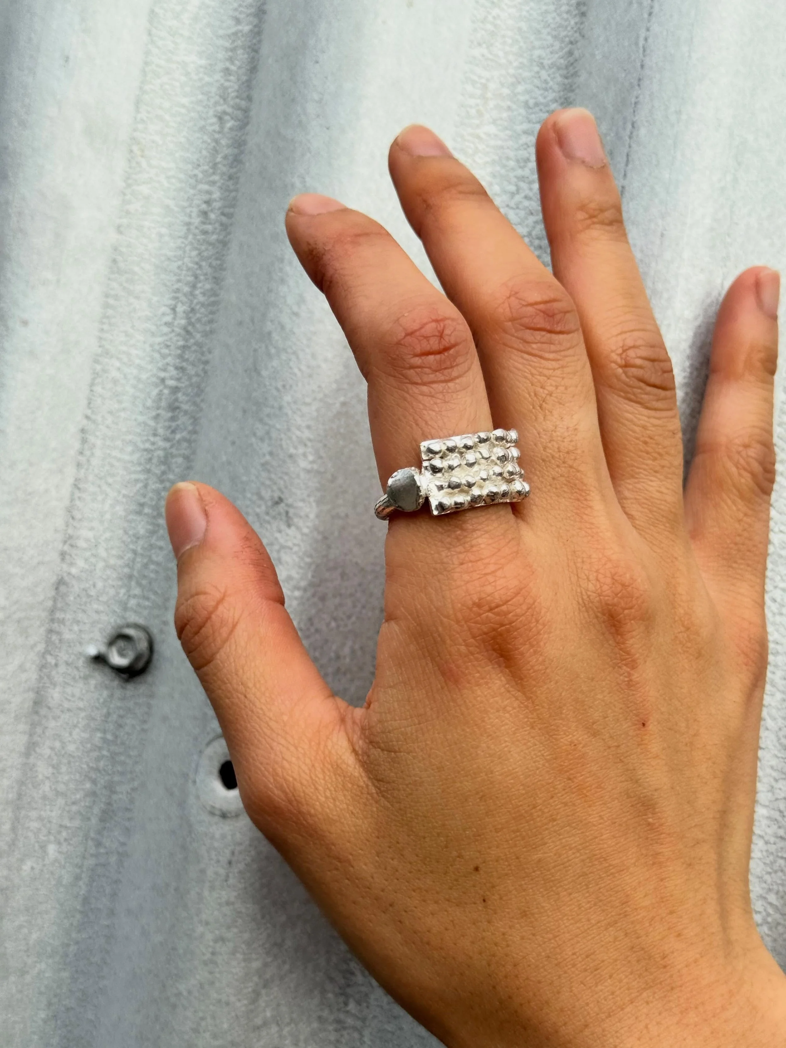 Series of One #131
Sterling silver ring.
Worn here by @magggieluu ✨✨✨
There is one of these rings and it is exclusive to my studio.

#handmade #unique #sterlingsilverring #katherinebowmanjewellery