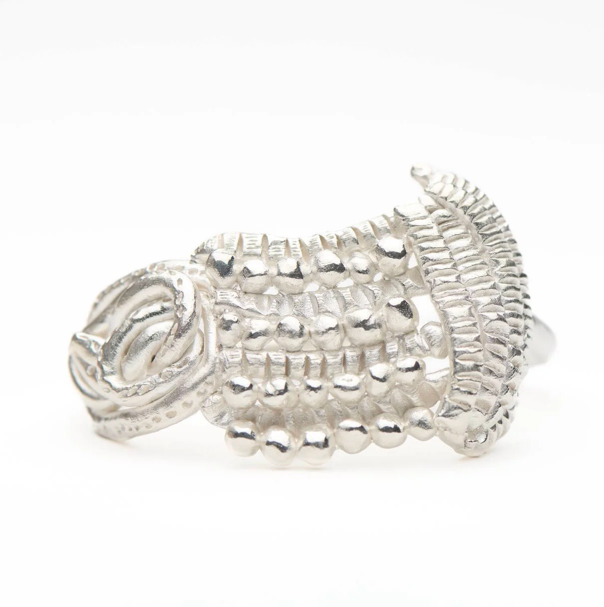 Aide-m&eacute;moire 
Sterling silver bangle.

Made for an exhibition from 2024.
The artist statement that accompanied the exhibition:
Jewellery has served many functions over the last millennium. It is a conduit to the gods, a sign of belonging and p