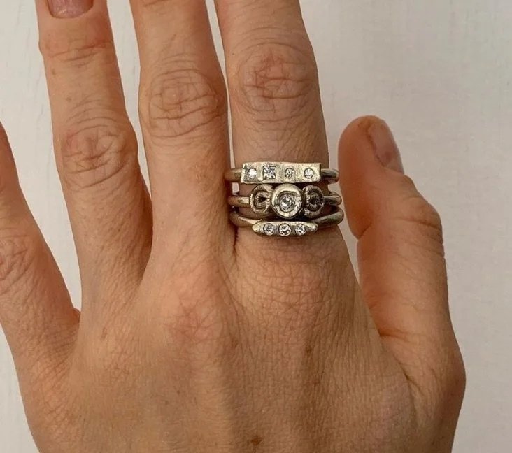 Diamonds and white gold!

9ct white gold Cantena ring set with diamonds.
9ct white gold Temple ring set with a diamond.
9ct white gold Mneme ring set with diamonds.

The Cantena ring is available online and directly through the studio. Both the Templ