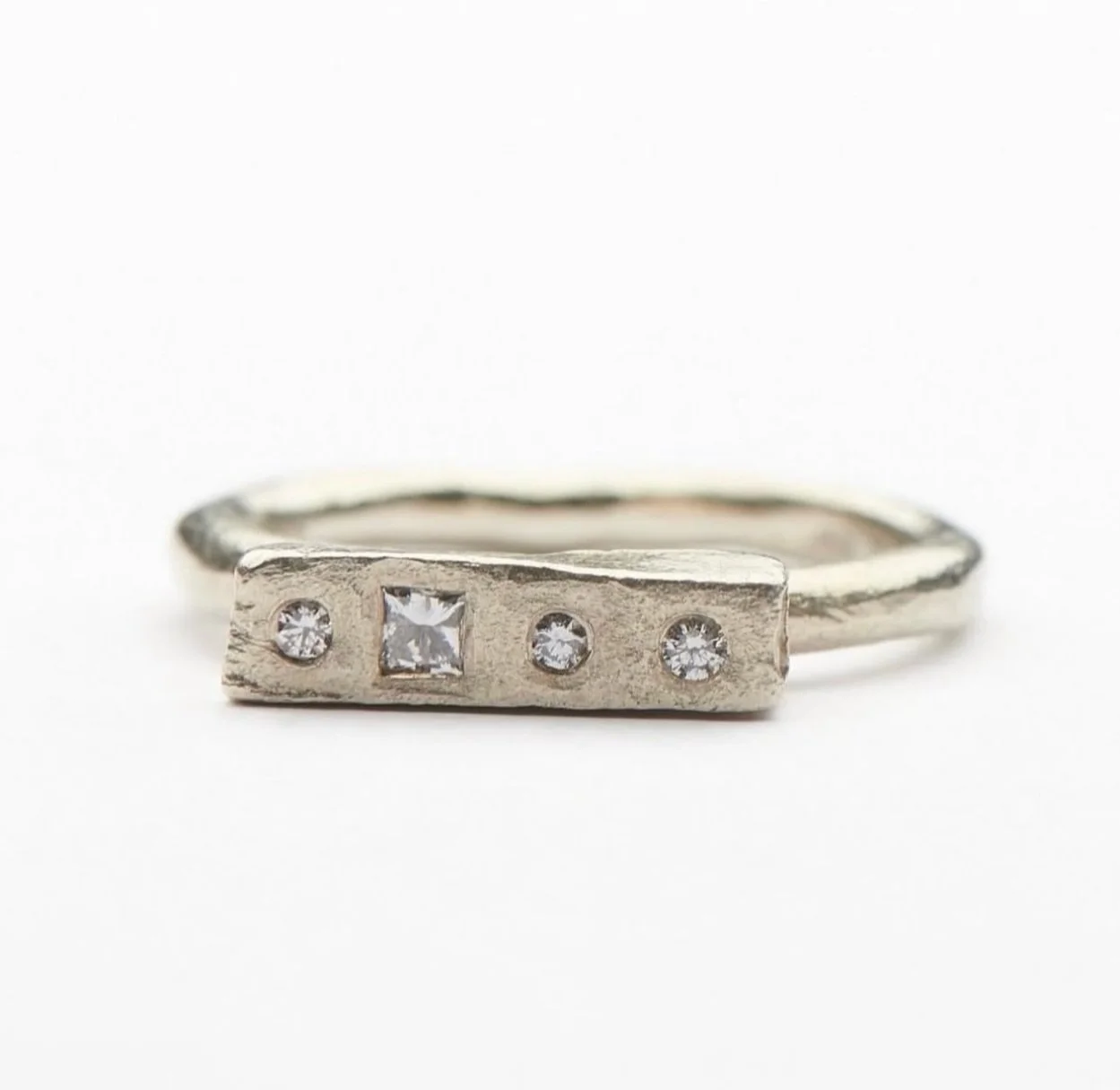 9ct white gold Mneme ring set with white diamonds.

In mythology, Mneme was the muse of memory. Also known as Mnemosyne. According to Hesiod, the Ancient Greek poet, Mnemosyne was the mother of the Nine Muses.

In &lsquo;Orlando&rsquo;, Virginia Wool