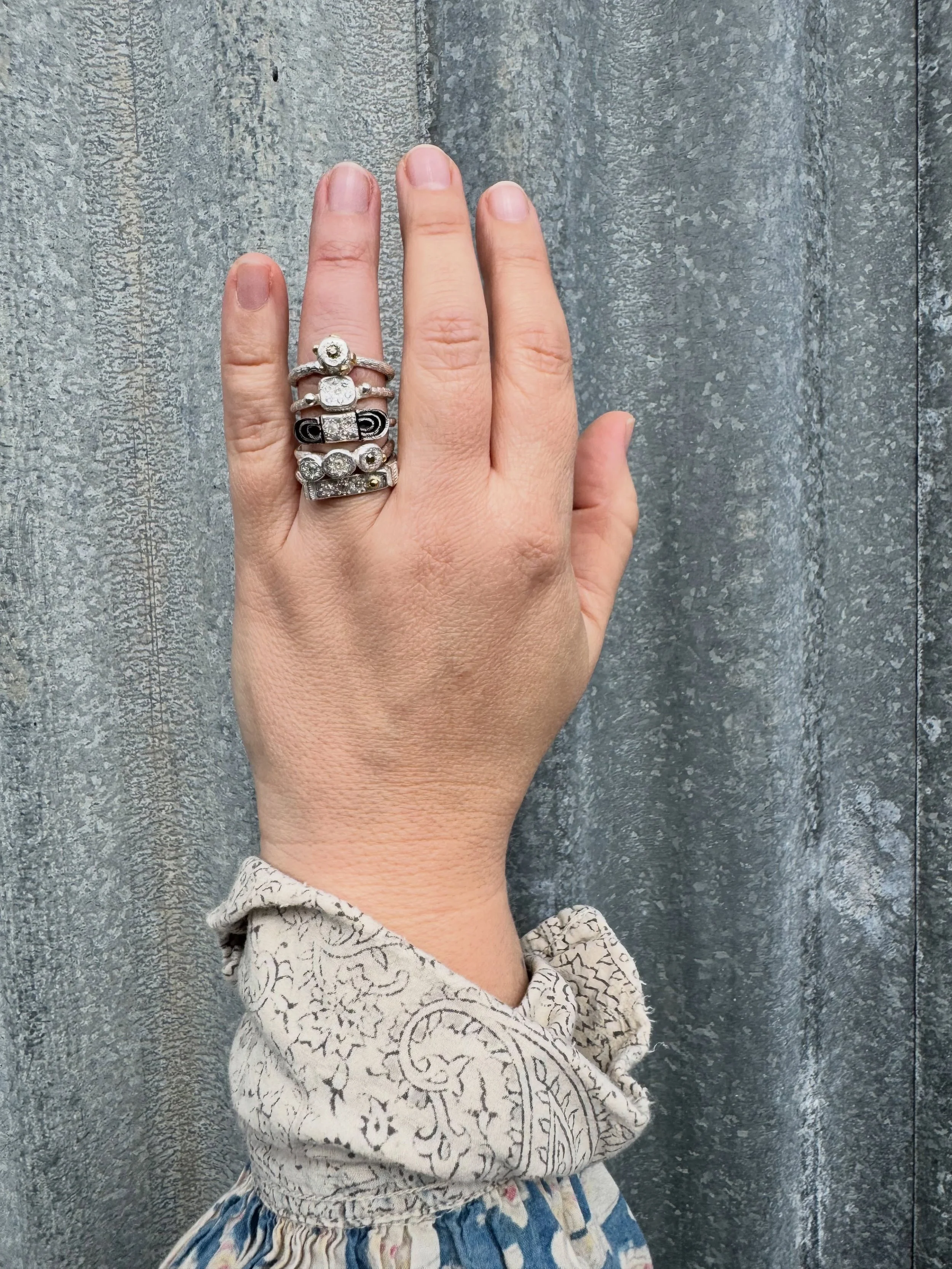 The diamonds in these rings (except for one) are from a parcel of loose diamonds that I have had for over ten years. I bought them from a retired diamond dealer.
Every single diamond in the parcel was different. Some were old cuts, others more like d