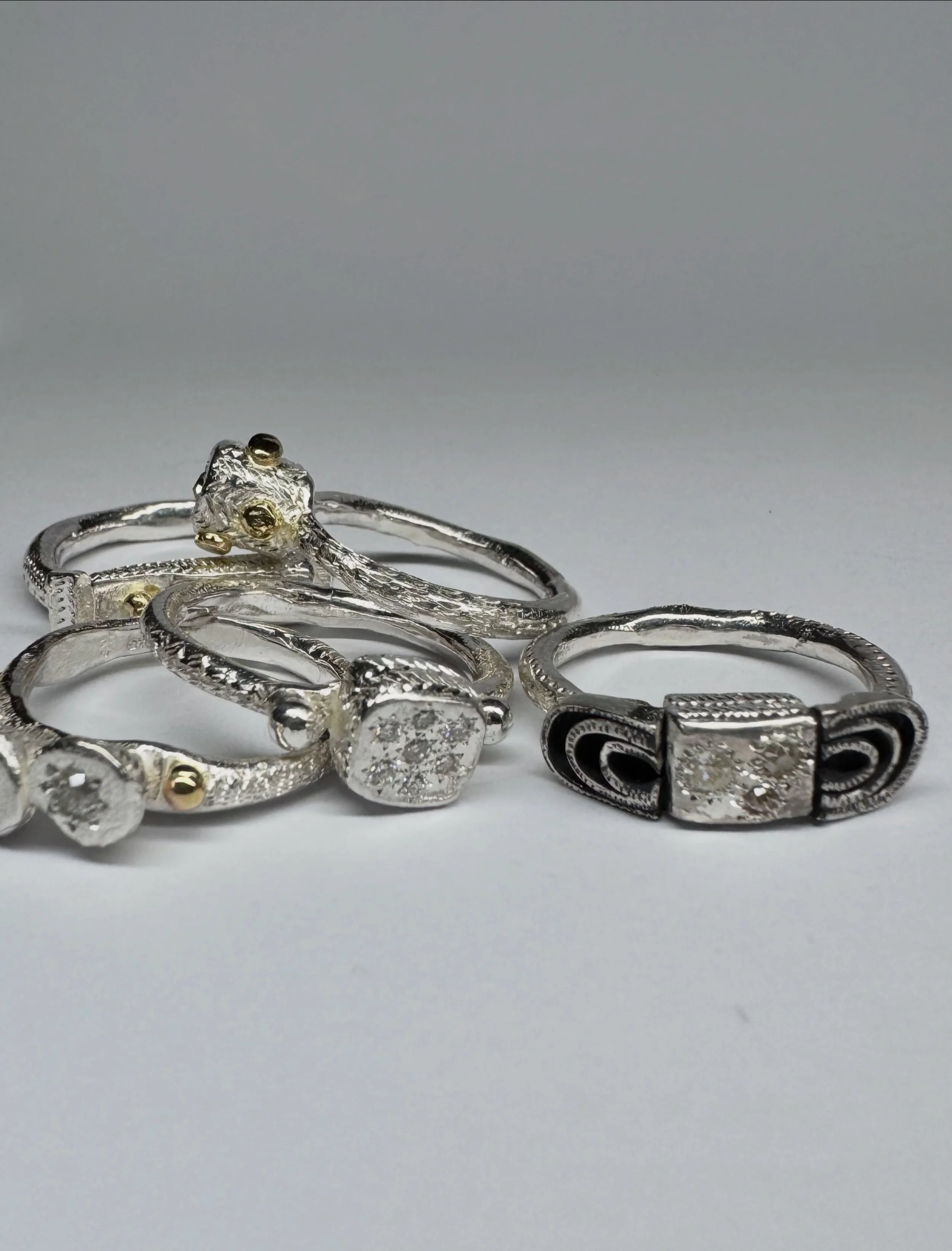 The diamonds in these rings (except for one) are from a parcel of loose diamonds that I have had for over ten years. I bought them from a retired diamond dealer.
Every single diamond in the parcel was different. Some were old cuts, others more like d