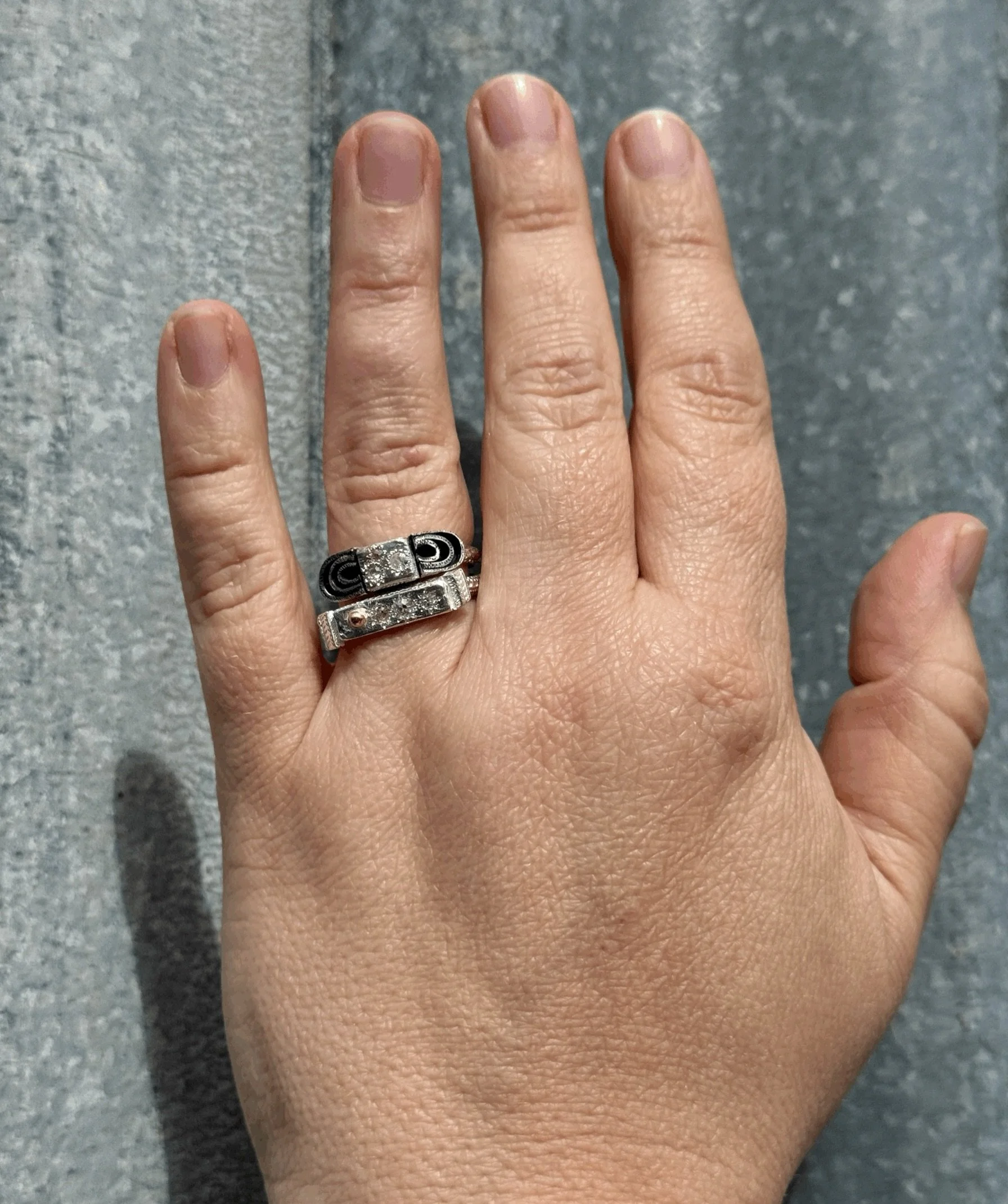 #176.
#174.

Series of One. 
There is only one of each of these rings. Each is unique. A one of a kind collection of diamonds, hand engraving, 18ct yellow gold  and oxidised details.

If you would like to make a time to view and try the rings - pleas