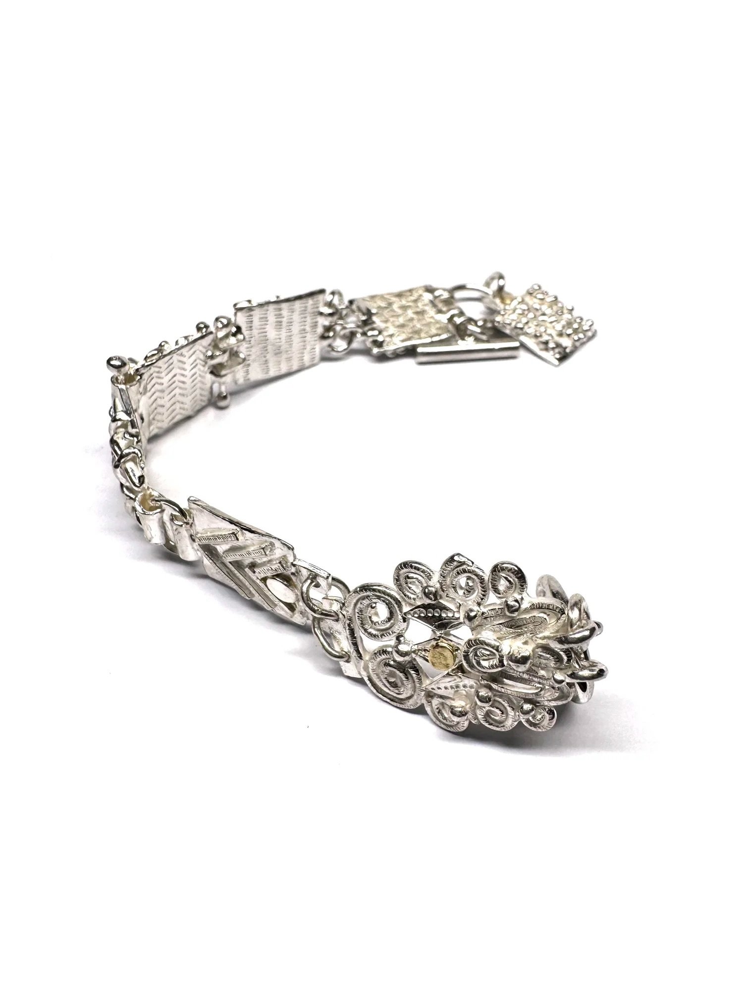 This bracelet is a treasure trove of textures and patterns and sensory experiences. Something to play with when worn, something to anchor oneself when out in the world.

Inspired by the traditional charm bracelet, this new handmade piece reimagines t