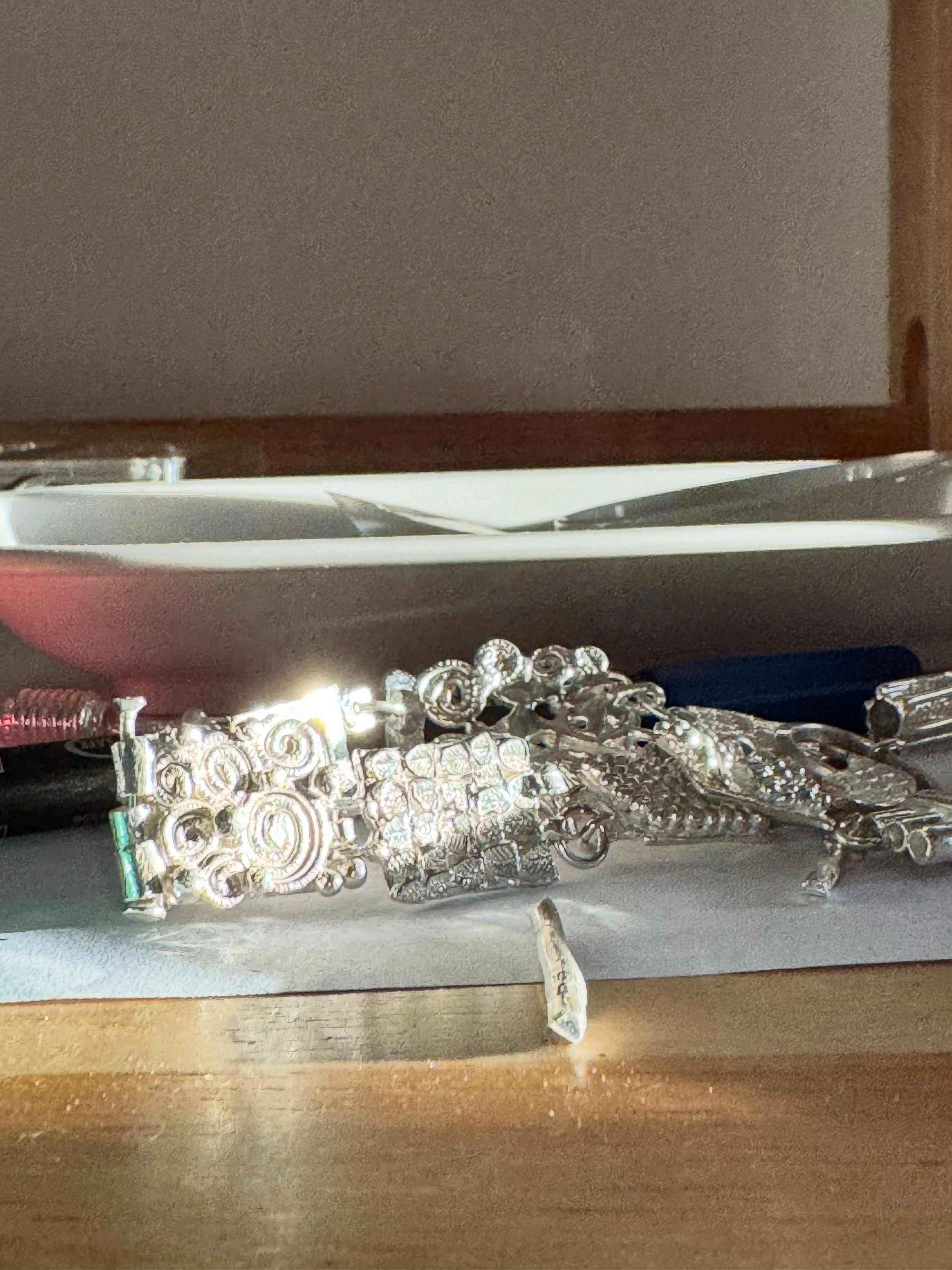 Series of One #178

While it was a work in progress.
Catching the light on my bench.

Trying different placements and attachments

All lined up. 2 pieces were taken out hand have been made into a pendant.

Finished work.
 
#handmade #bespoke #bracele