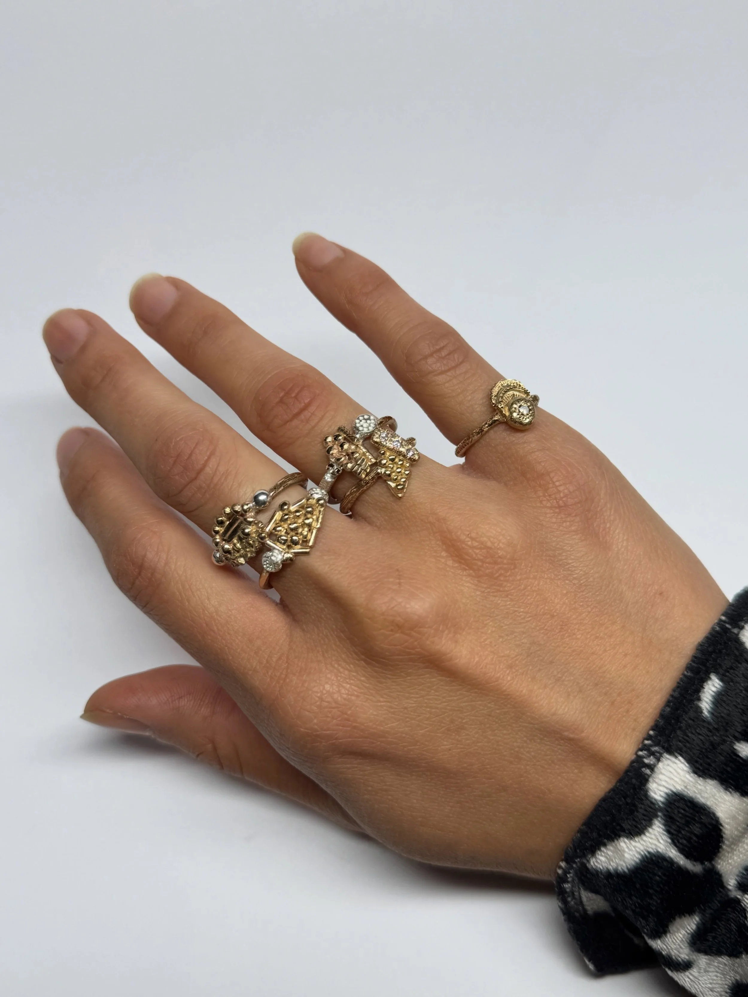 Three new rings have been added to my Series of One collection, continuing an exploration of fragmented embroidery motifs that began in an earlier group of work. Details drawn from embroidery patterns are taken out of their original context, broken a