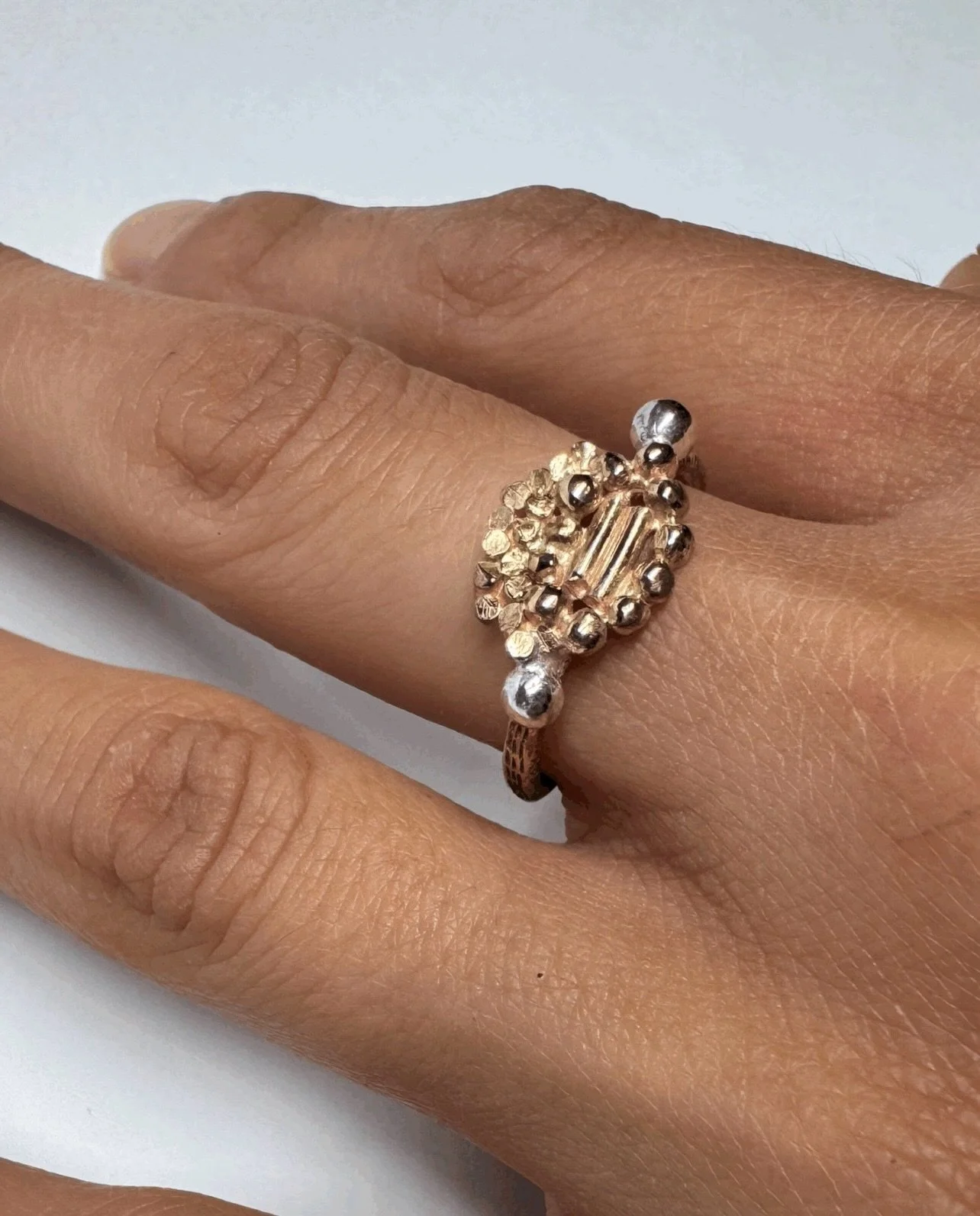 #181. Series of One.
Handmade 9ct yellow gold ring with sterling silver details and hand engraving.

Three new rings have been added to my Series of One collection, continuing an exploration of fragmented embroidery motifs that began in an earlier gr