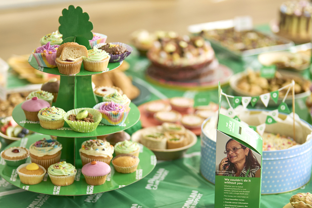 selection of different cakes on  green table cloth