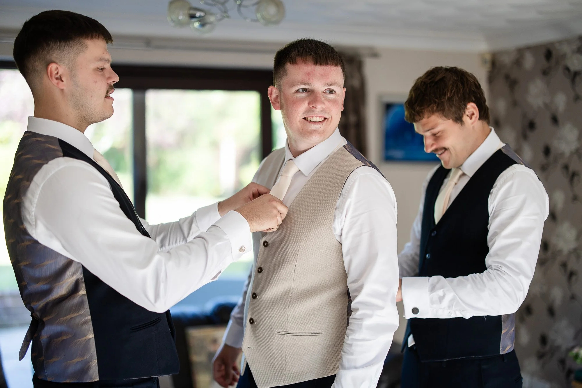 groom getting ready with groomsmen