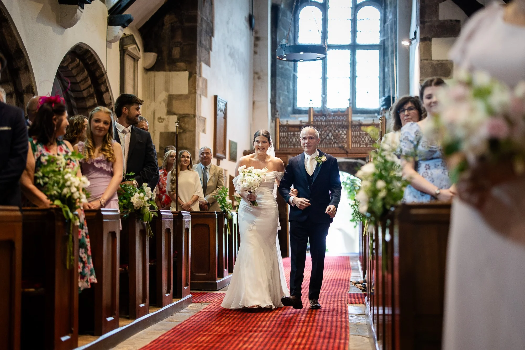 bride walking up aisle with dad