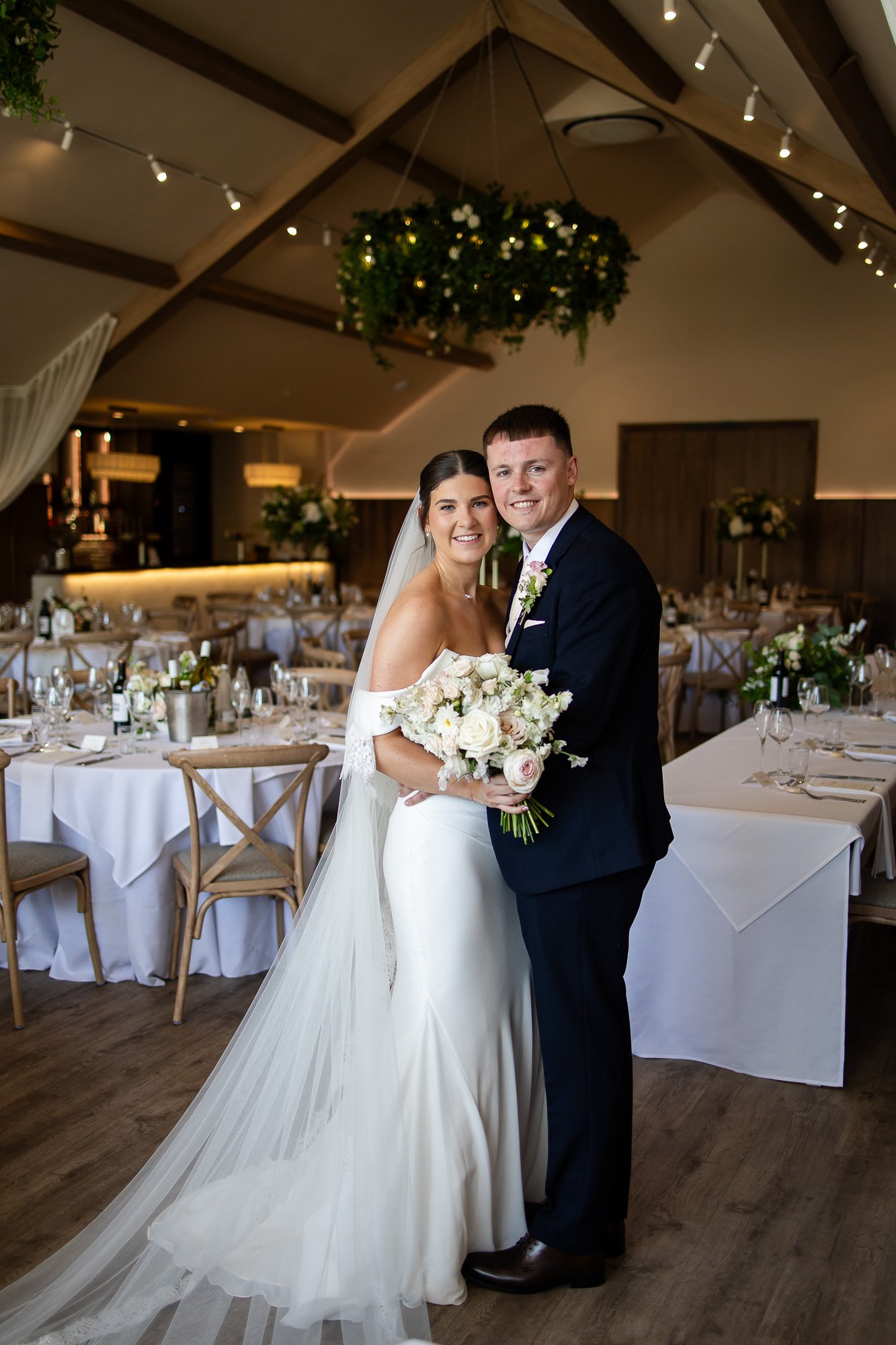 bride and groom in garden room