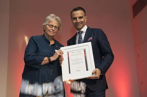 WSLD Patron Kerry Schott (LEFT) presents the Brand Champion Prize to Angelo Kourtis from WSU