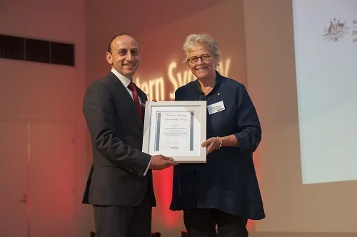 WSLD Patron Kerry Schott presents the corporate philanthropy prize to Karl Bitar from Crown Resorts 