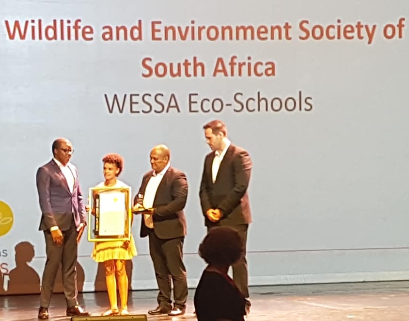   WESSA Eco-Schools  GM, Donavan Fullard and WESSA Programme Manager, Cindy-Lee Cloete as they accept the trophy and certificate. 