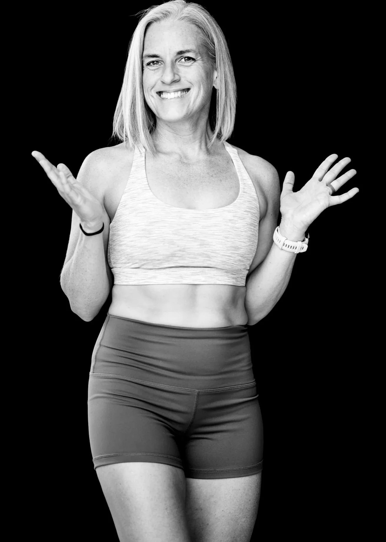 a woman in workout clothes following a strength training program for women