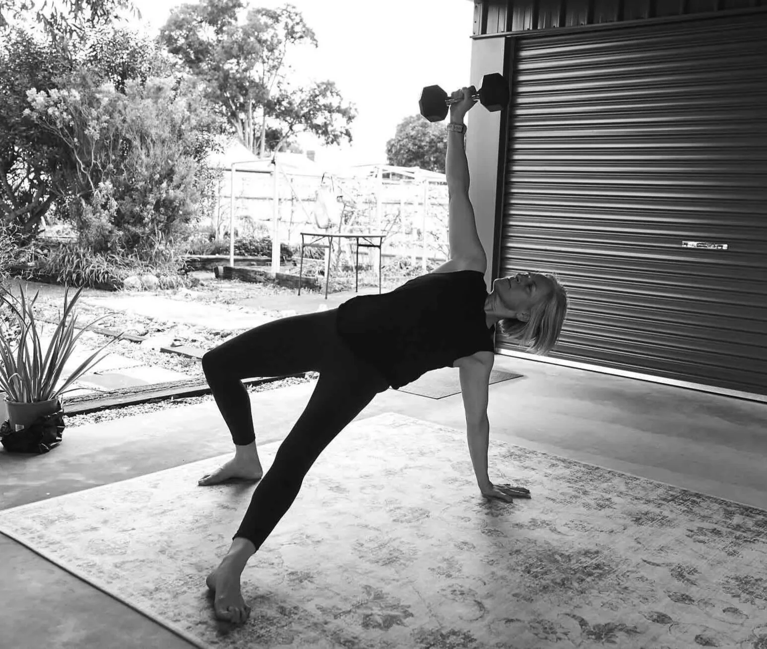 strength training women over 40 personal trainer demonstrating a turkish getup