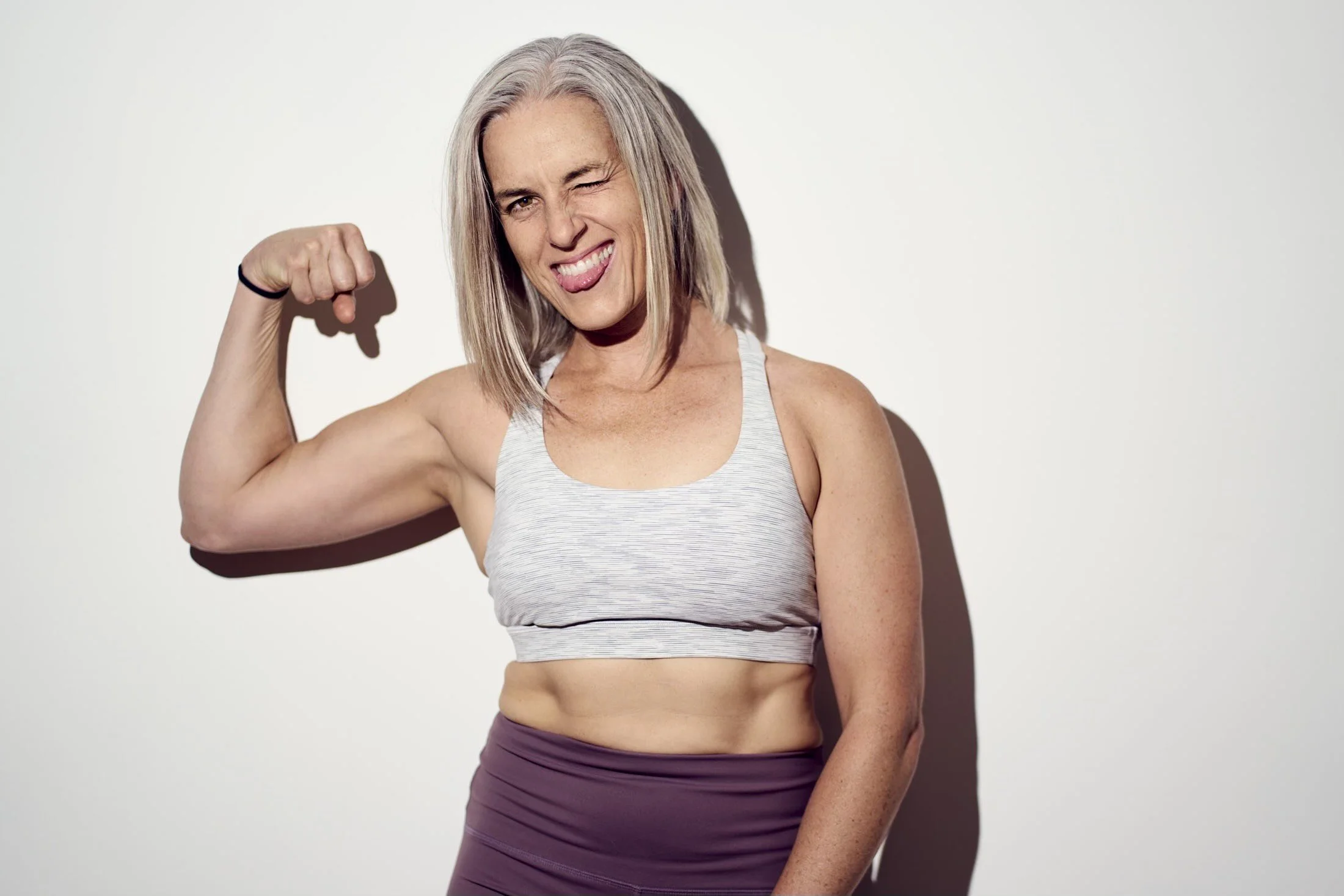 strength training plan for women over 40 a strong woman tensing her bicep