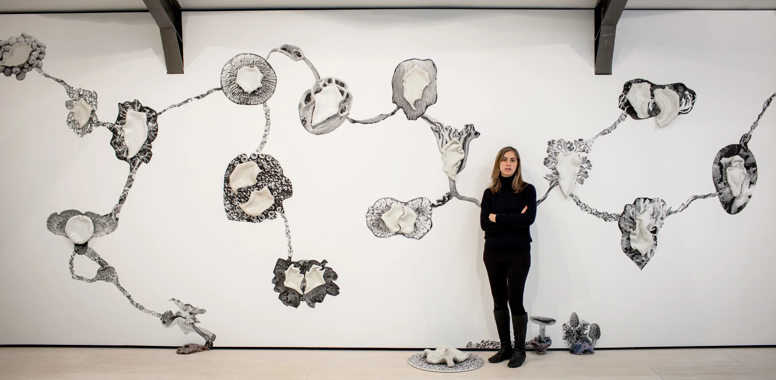  Photo by  Ivan Gonzalez  A Garden For Beatrix (installation view), 2014-15 Stoneware and stoneware porcelain and glazing on pigment ink print Dimensions variable (7m wall) 