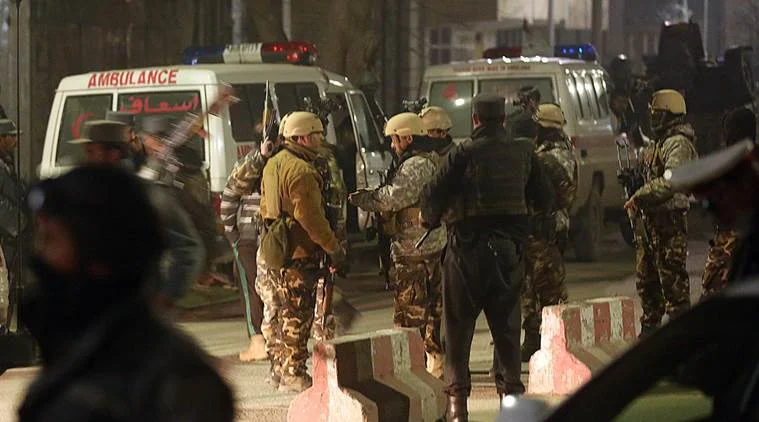 Afghan security forces stand guard near a terrorist attack site, close to the Spanish embassy, in the center of Kabul, Afghanistan, Friday, Dec. 11, 2015. An Afghan official says a car bombing near a foreign guesthouse in central Kabul has wounded one person. (AP Photos/Massoud Hossain) 