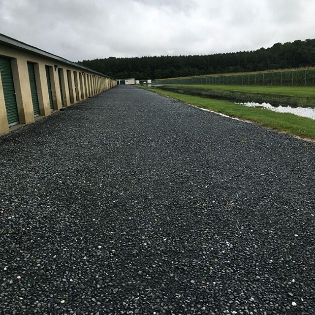 As always, we're high &amp; dry! The power of a well designed and properly graded site keeps water away from the buildings, funneling it down the center of the roadways and into the storm water management pond. 👍