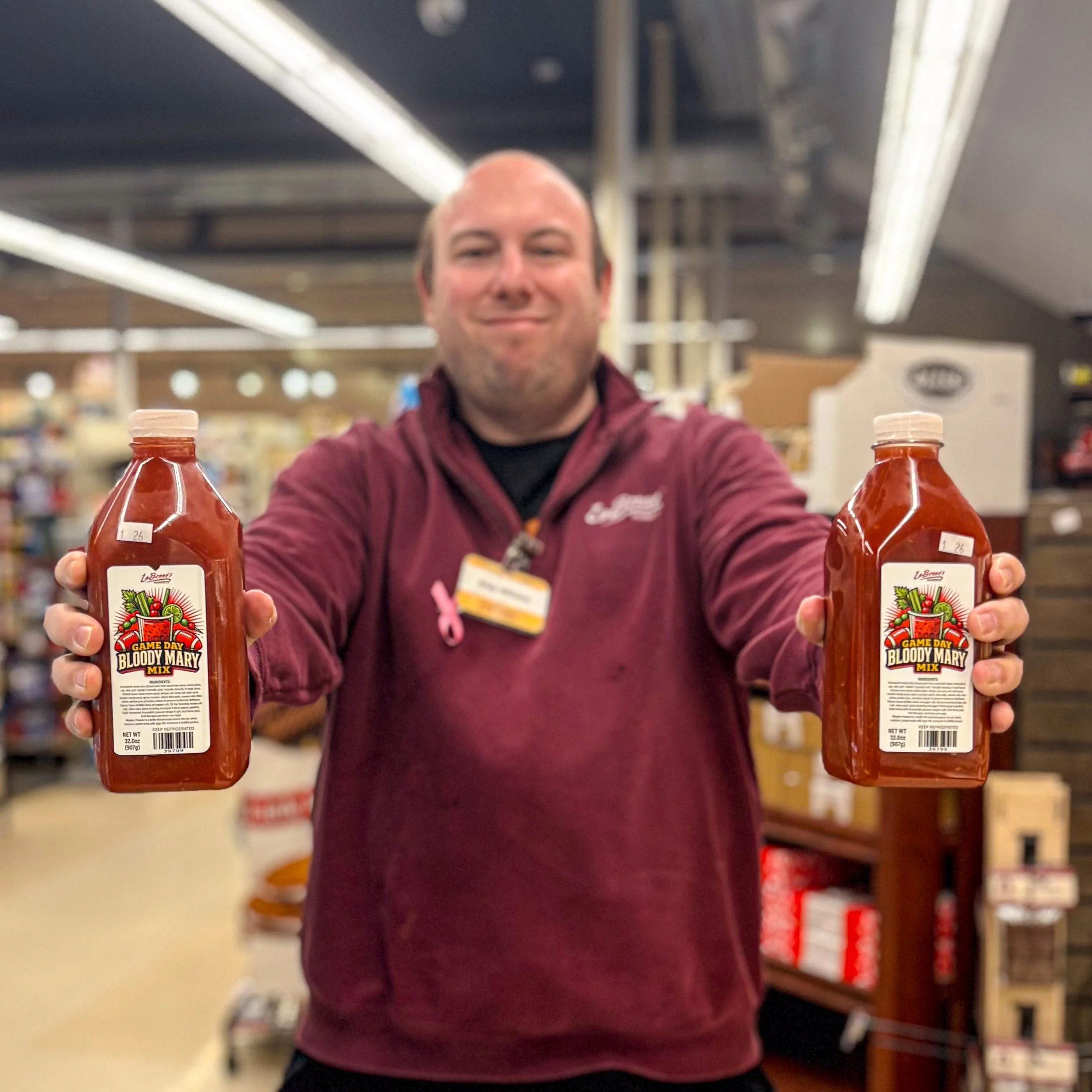 Andy holding our Game Day Bloody Mary MIx.