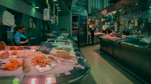 Frozen seafood section with packaged fish and shellfish in a grocery store