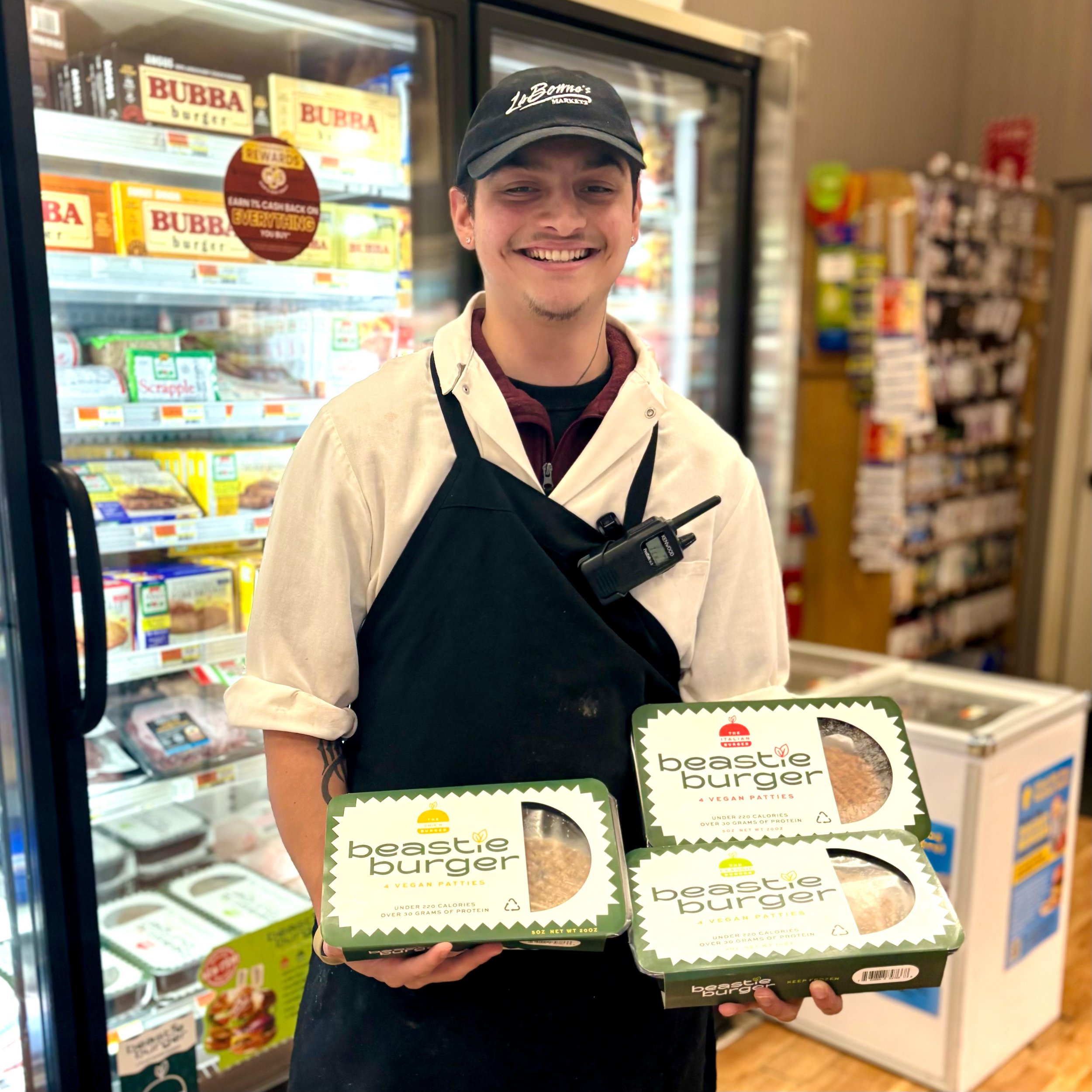 Woodbury employee holding Beastie Burger packages