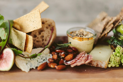Assorted sandwich platter with deli meats, bread, and sides