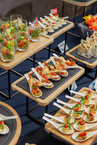 Tiered serving trays with assorted party appetizers and finger foods