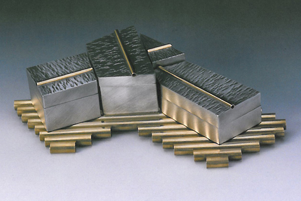   Four Box Puzzle  , 1998, pewter and brass, 2x10x7 inches  
