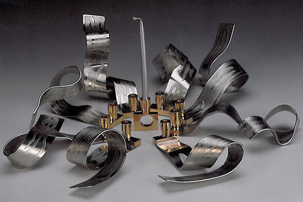   Ribbons of Light - Hanukkah Menorah  , 2000, pewter and brass, 5x18x18 inches  