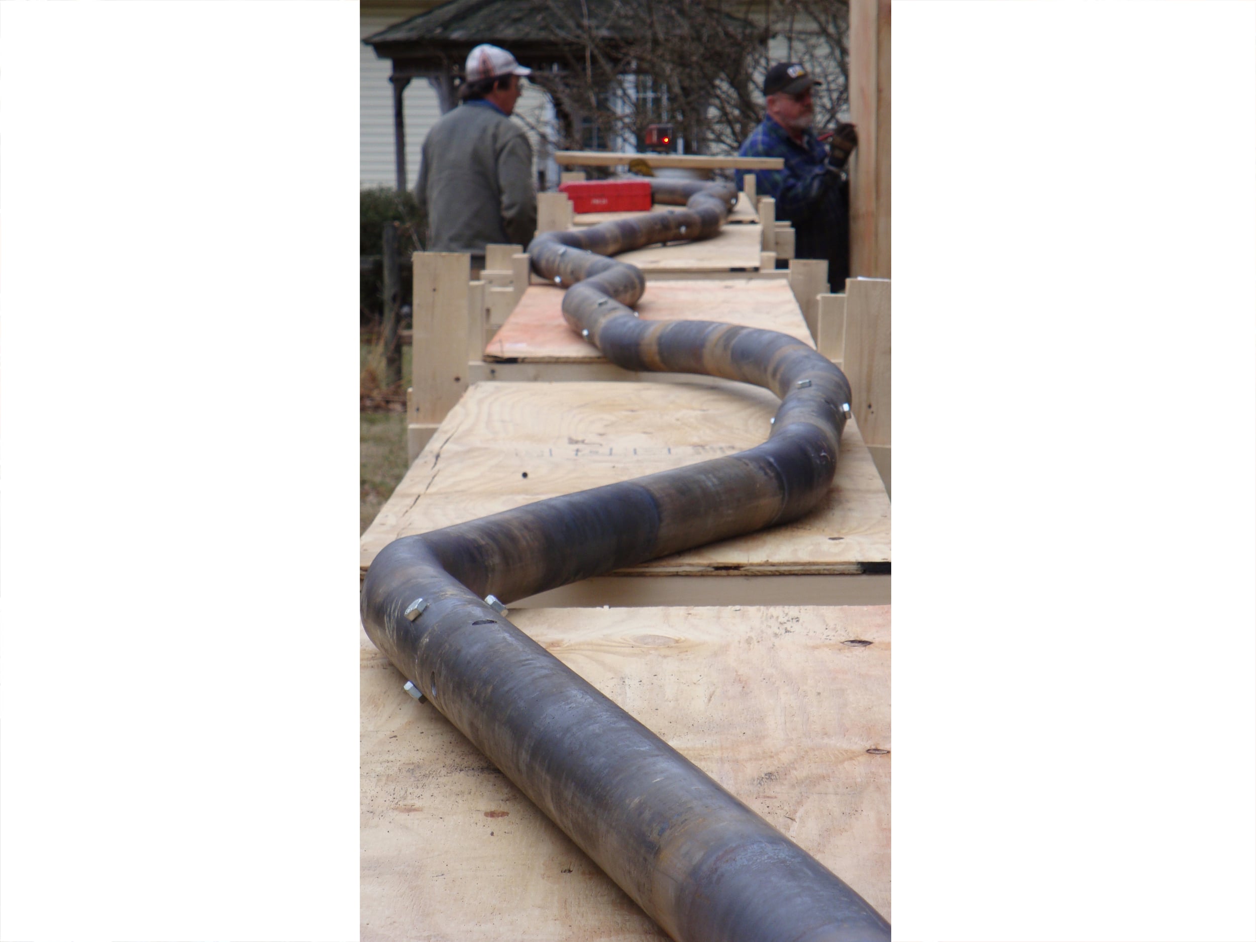 Attached tubes are being formed into a ROOT shape to fit the exact measurement of the final site