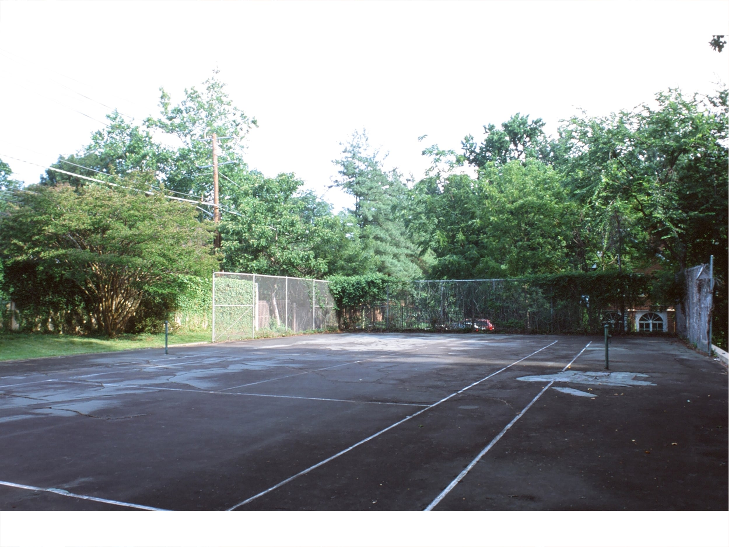The unused and dilapidated tennis court