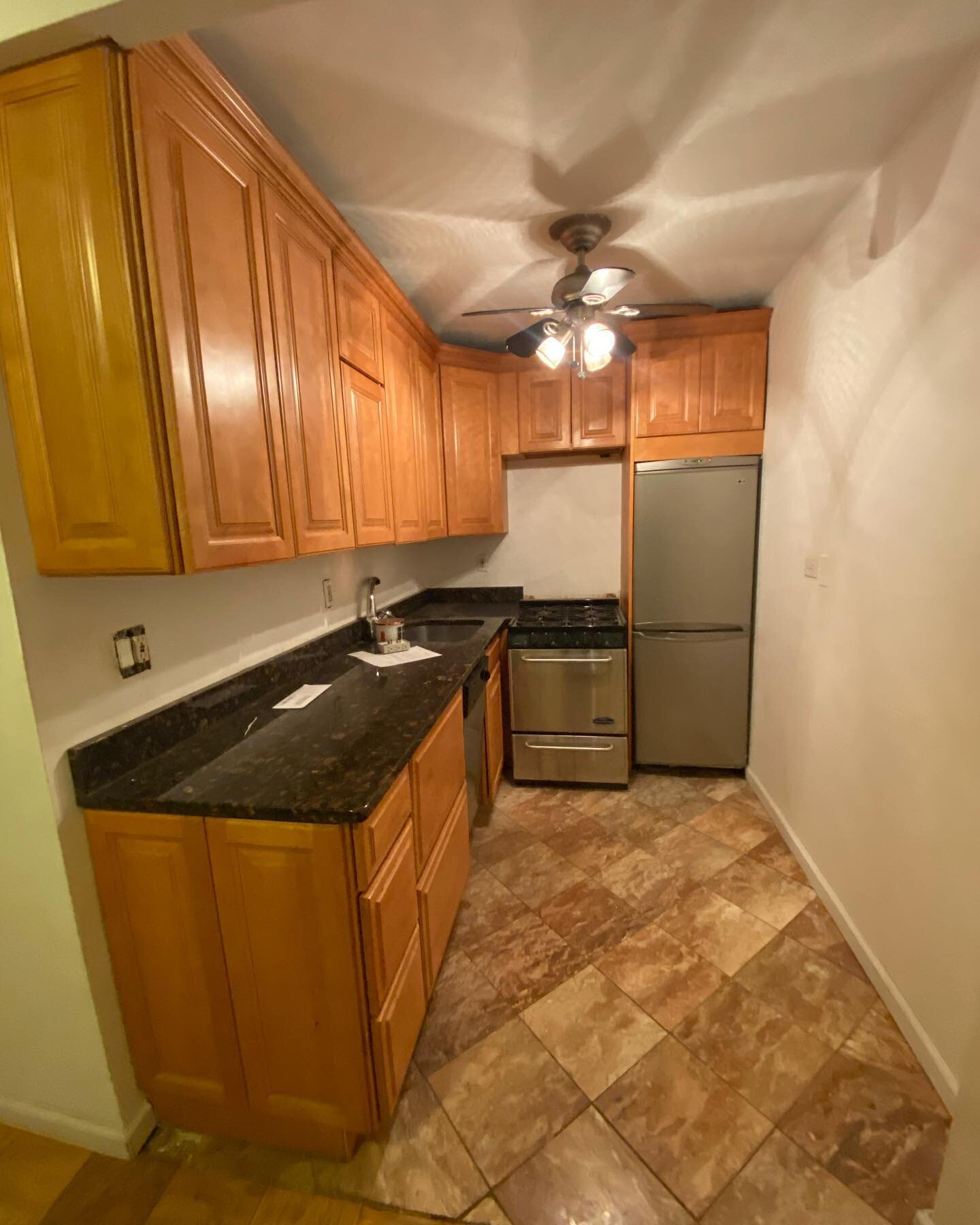 Before and After Photos of a Brooklyn Heights Kitchen Renovation in a High Rise Building.  This project included demolition, full plumbing roughing, electrical wiring, drywall, skim coating, new Lifeproof LVT flooring, Kitchen cabinetry and a Quartz 