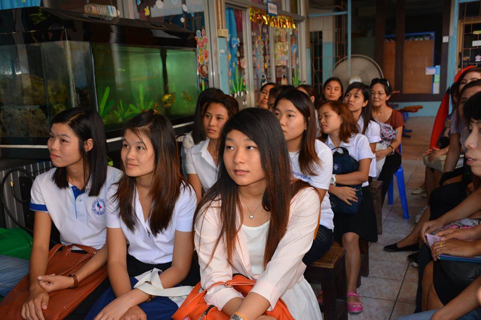 A group of young women in Burma eagerly listening on how to become a Wedu Rising Star.