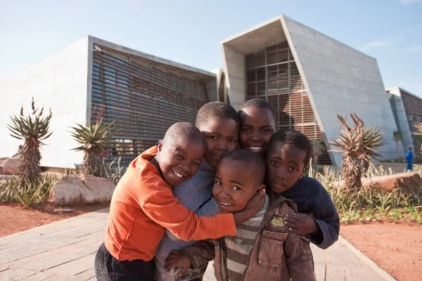  A group of Ubuntu's students gather outside the Ubuntu Centre after school in 2012. 