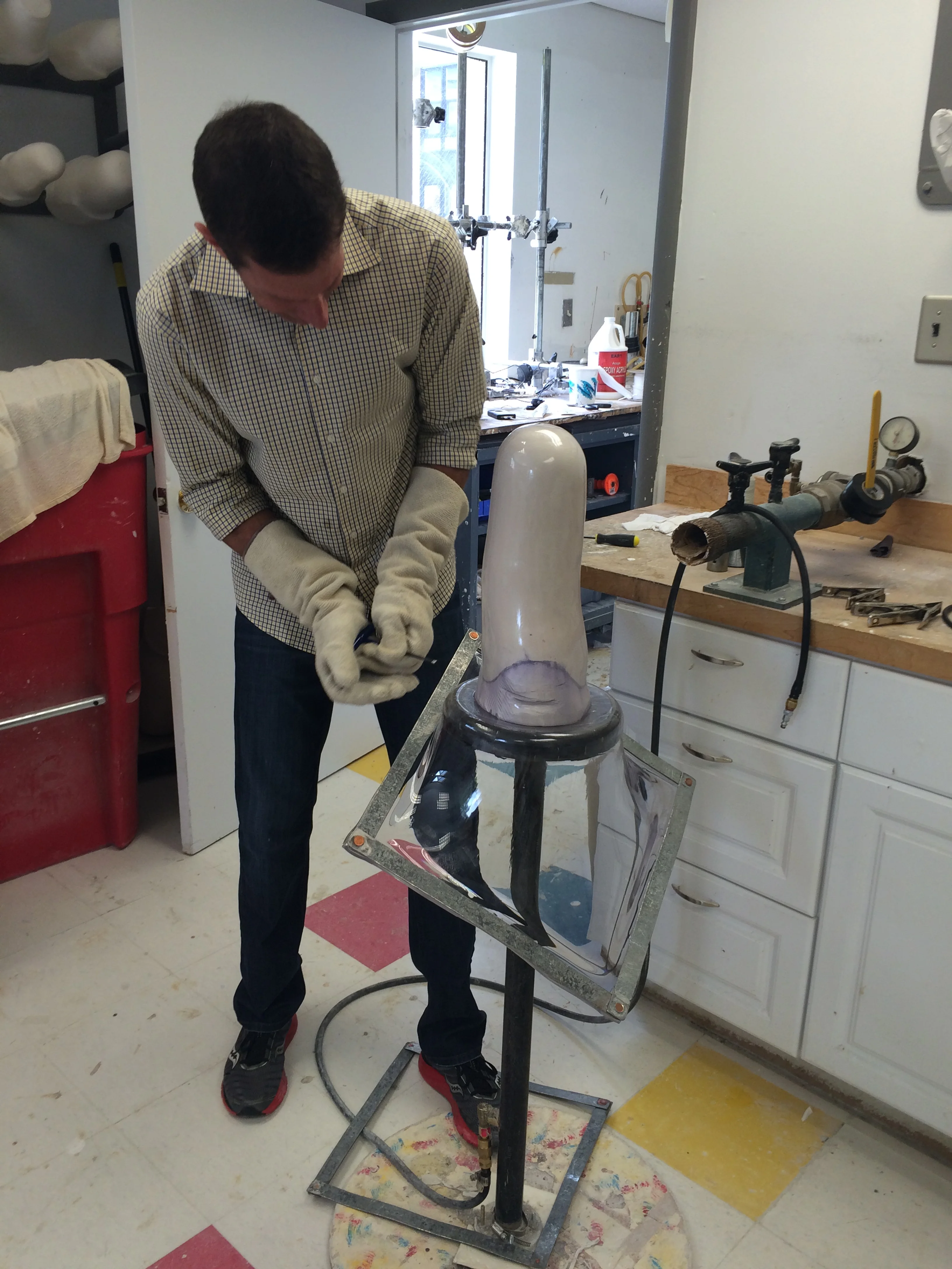 Once the cast is made, they place a piece of plastic over it and melt it down to make the socket.
